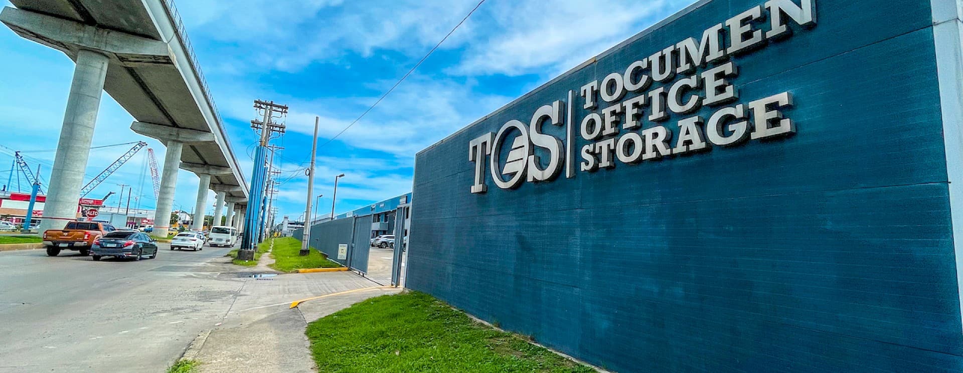 Tocumen Office Storage sign on the blue wall of the warehouse-office complex