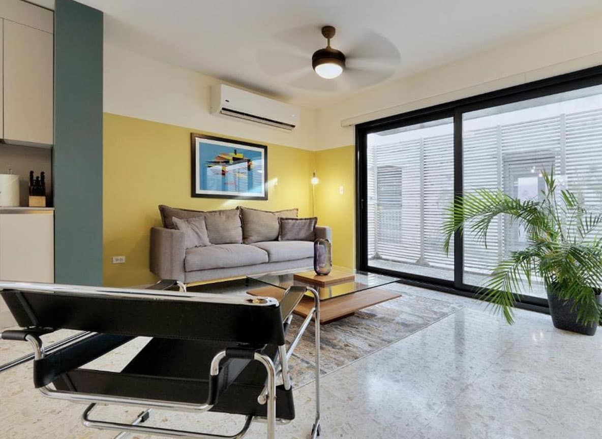 La Moderna apartment living room with floor-to-ceiling windows