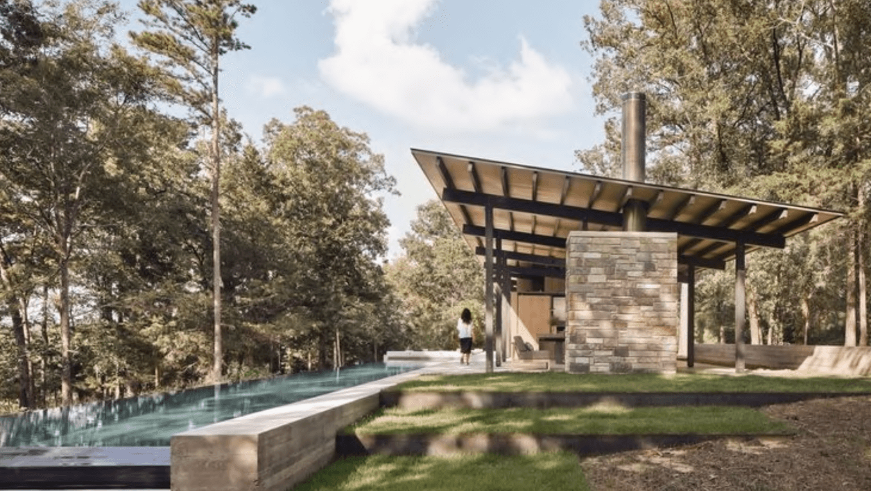 Rendering of the Vista Kaelo clubhouse with stone chimney and infinity pool