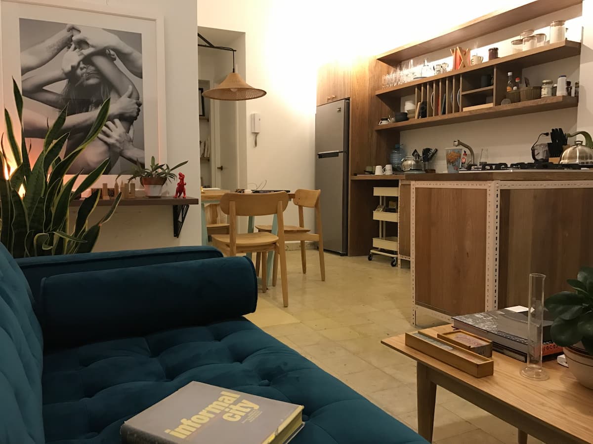 Furnished living room and kitchen of a Casa 8-23 apartment in Casco Antiguo