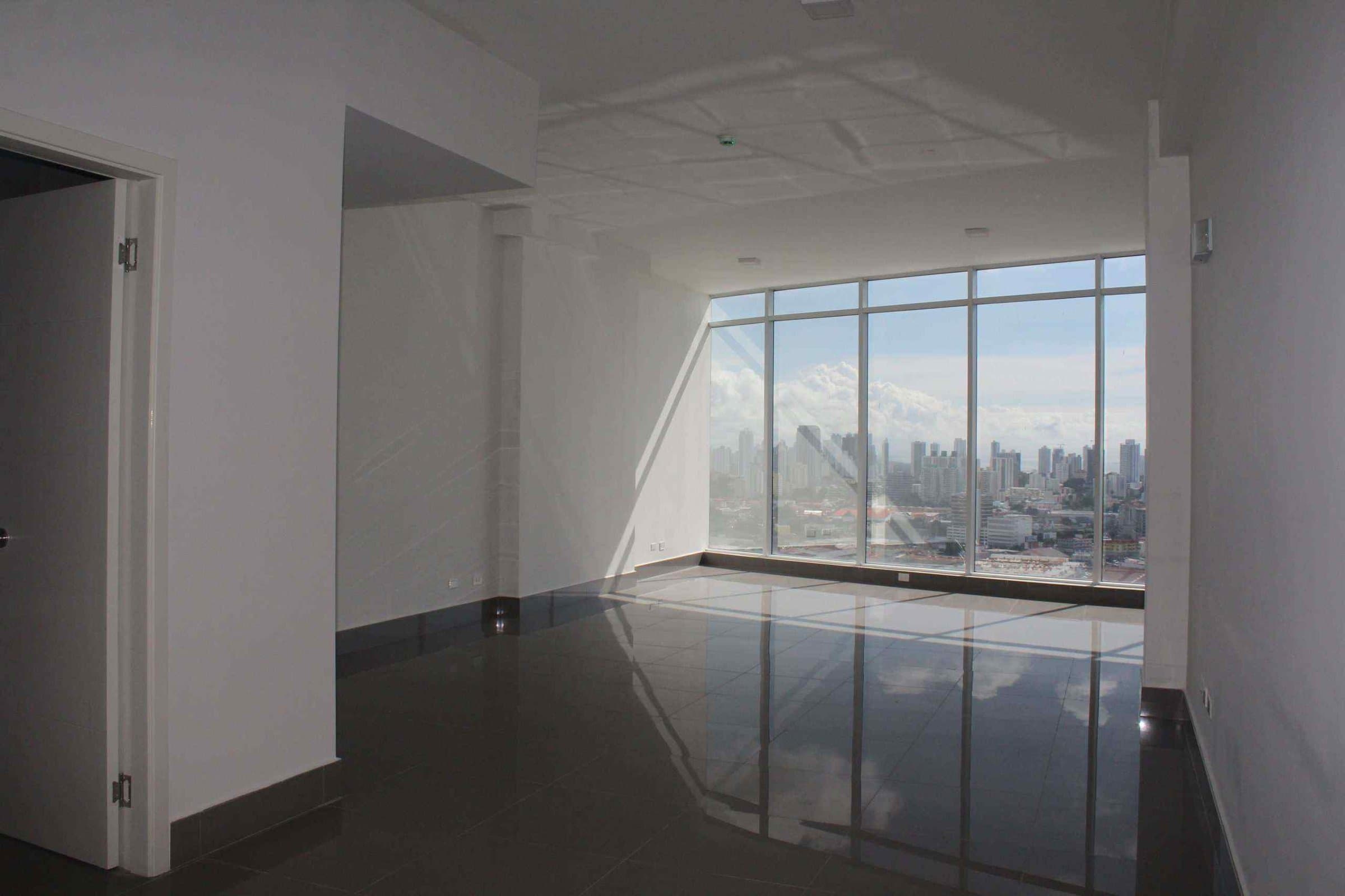 Finished office with floor-to-ceiling windows and city views at Golden Point Tower