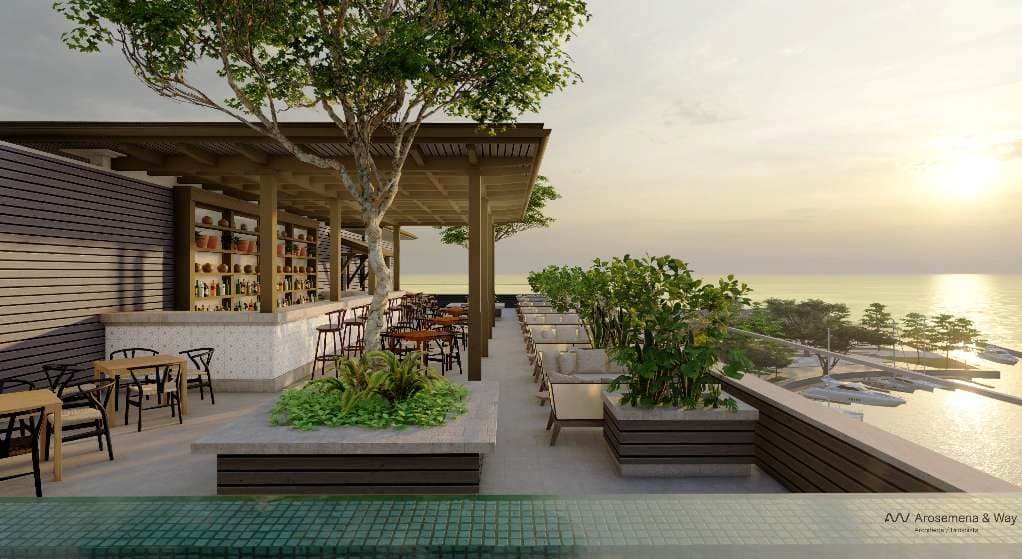 Rooftop restaurant terrace at Marine Lodge overlooking the sea at sunset