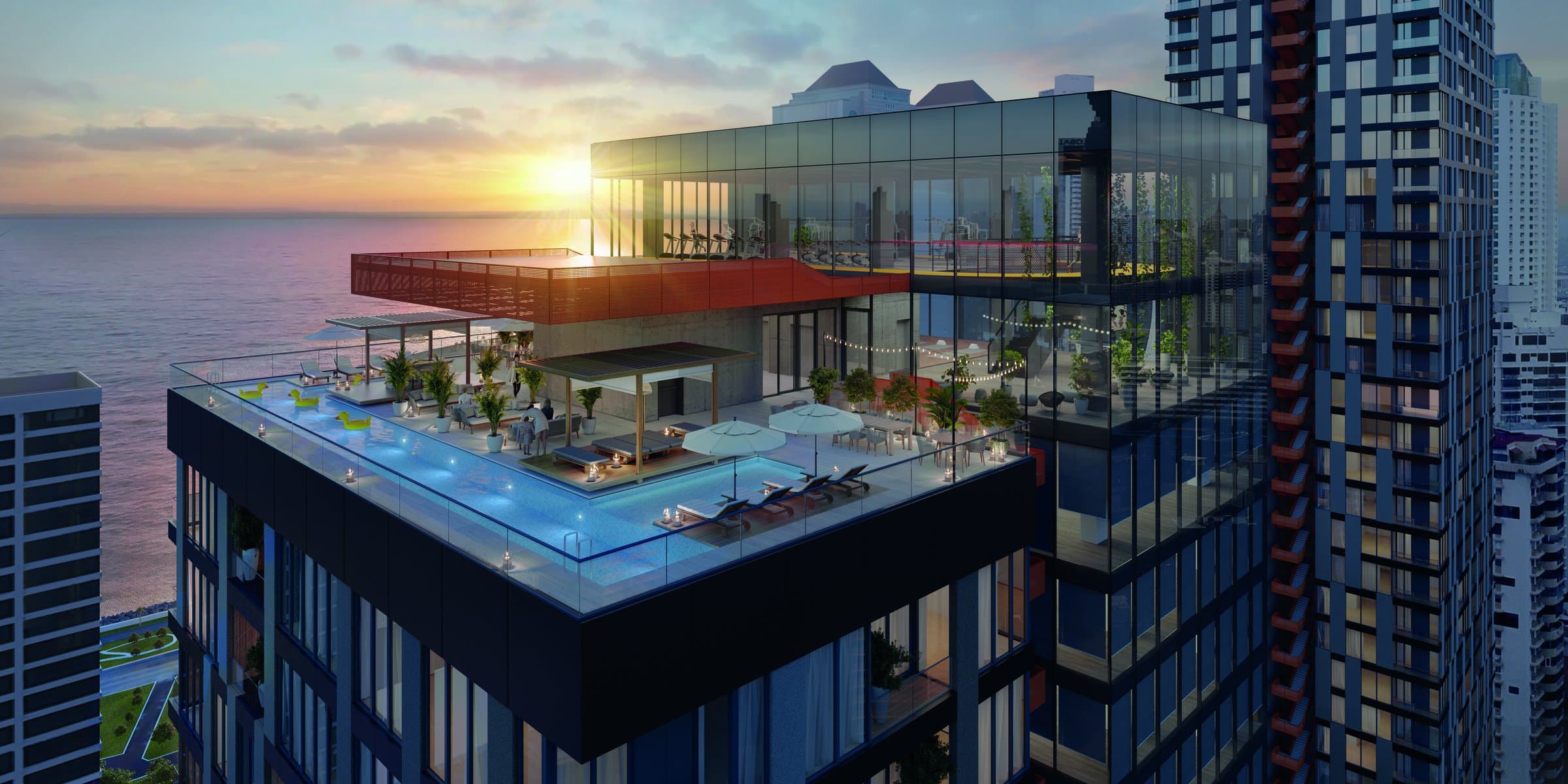 Uptown rooftop infinity pool at sunset over the bay
