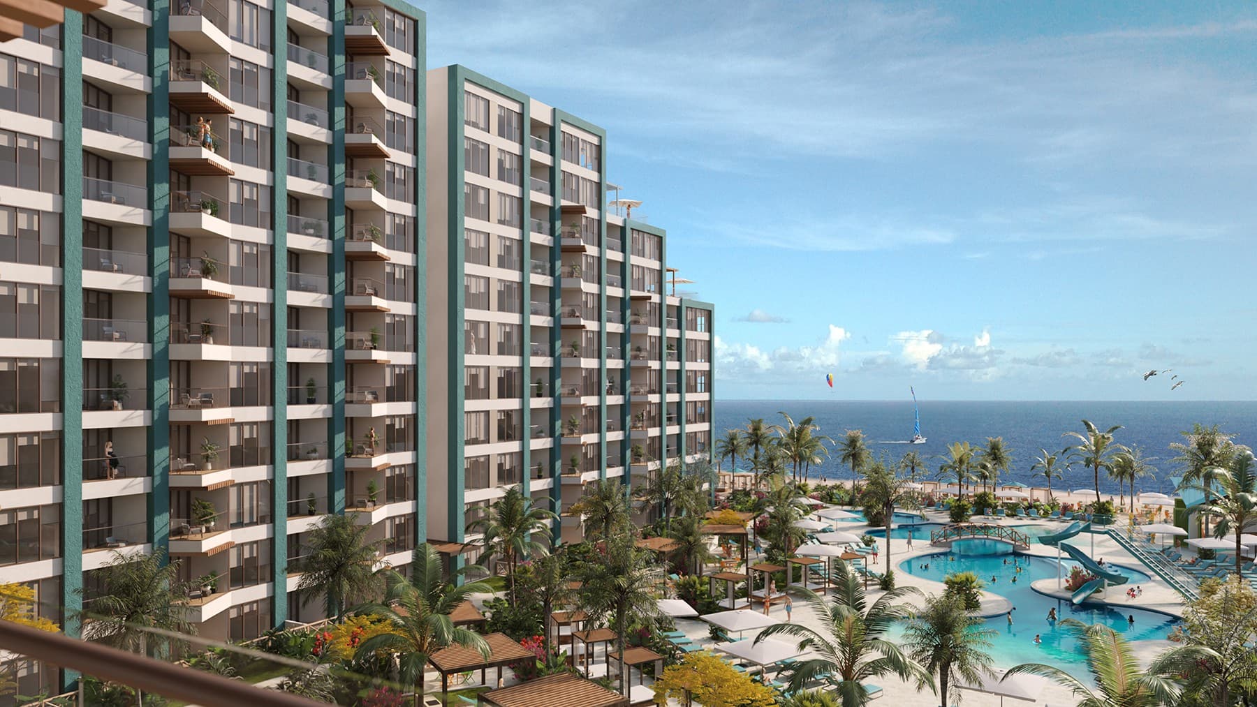 Condo towers of Margaritaville Beach Resort & Residences Playa Caracol over the resort pools and the Pacific