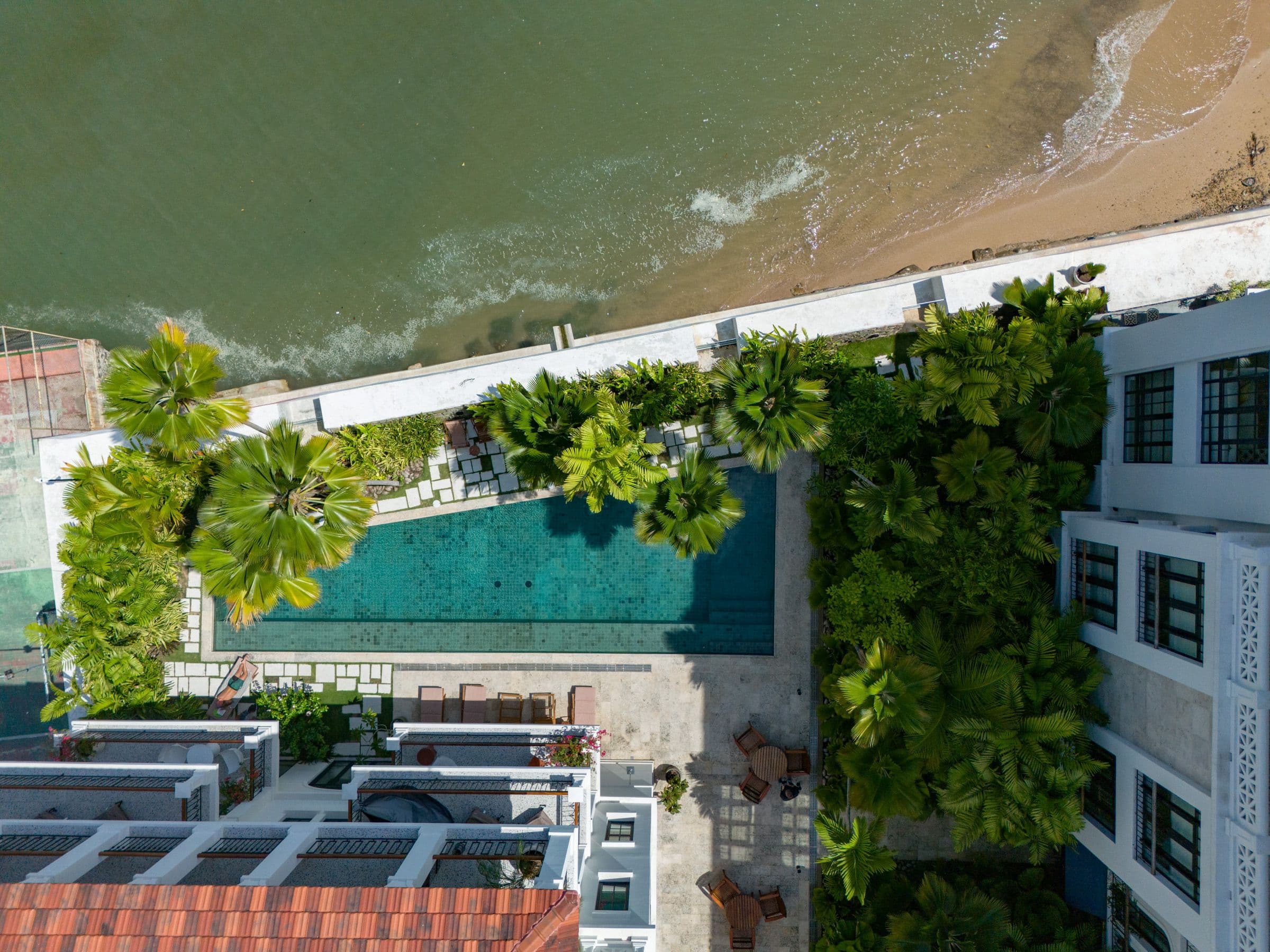 Aerial view of a pool among gardens at Gran Central, La Central City Flats & Club