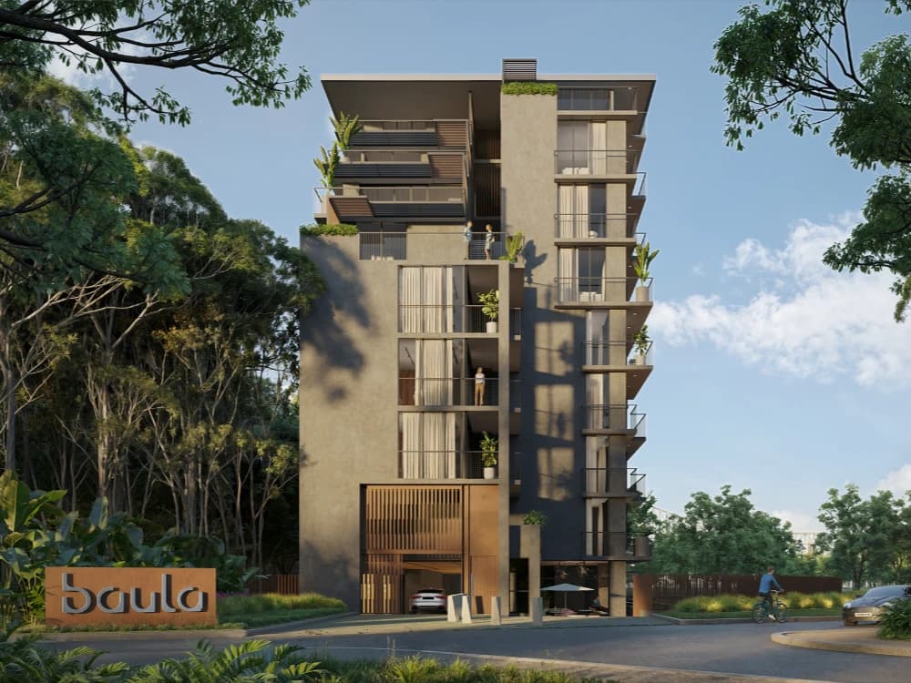 Facade of Baula Residences framed by tropical trees, Amador