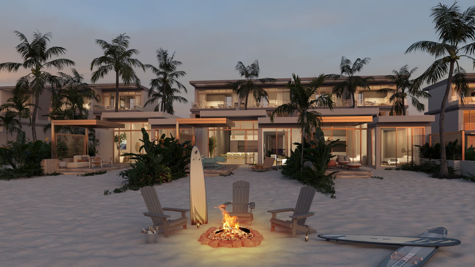 Seashore Beachfront Villas on the sand at dusk, with a beach fire pit