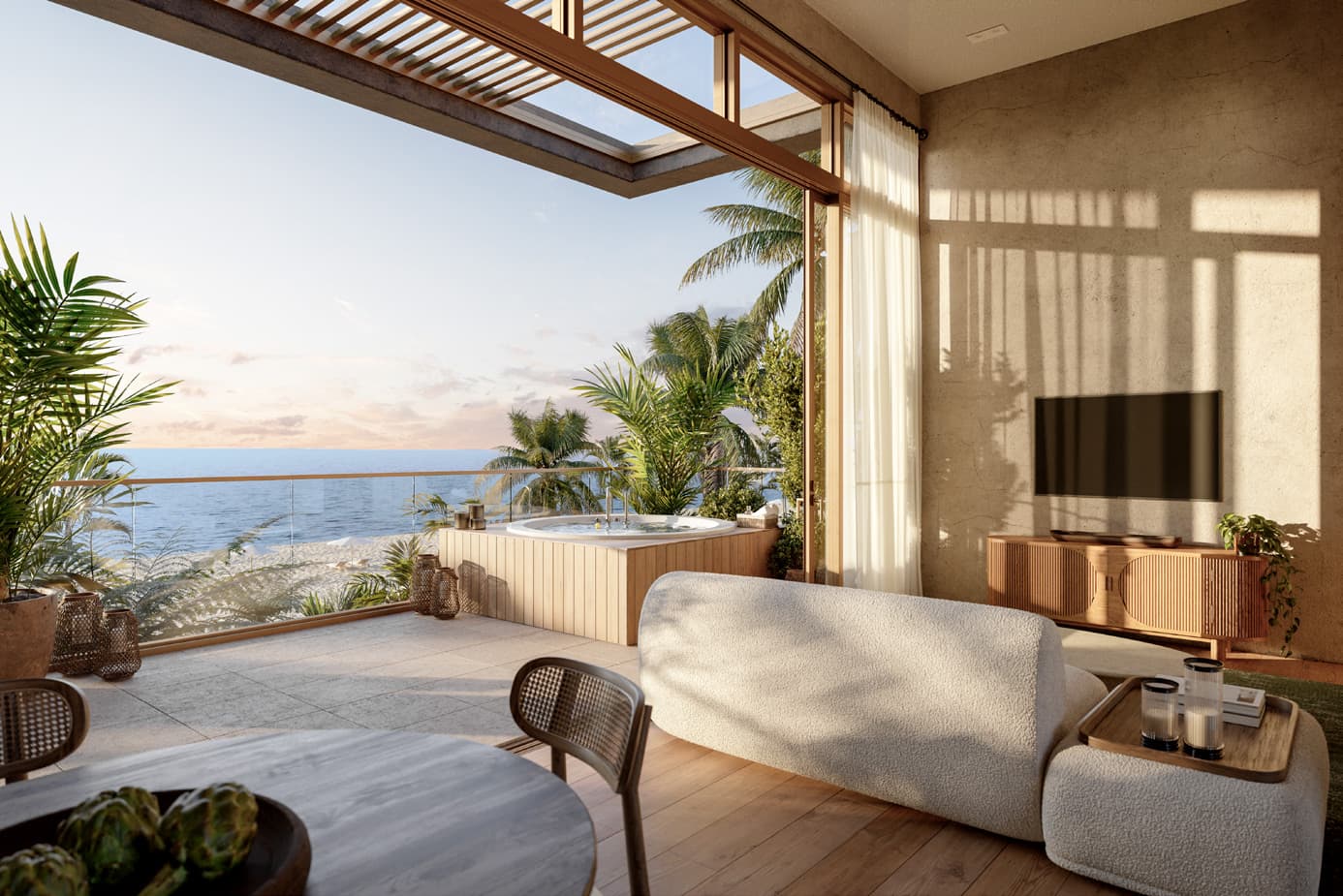 Ocean-view living room with jacuzzi terrace at Seashore Beachfront Villas