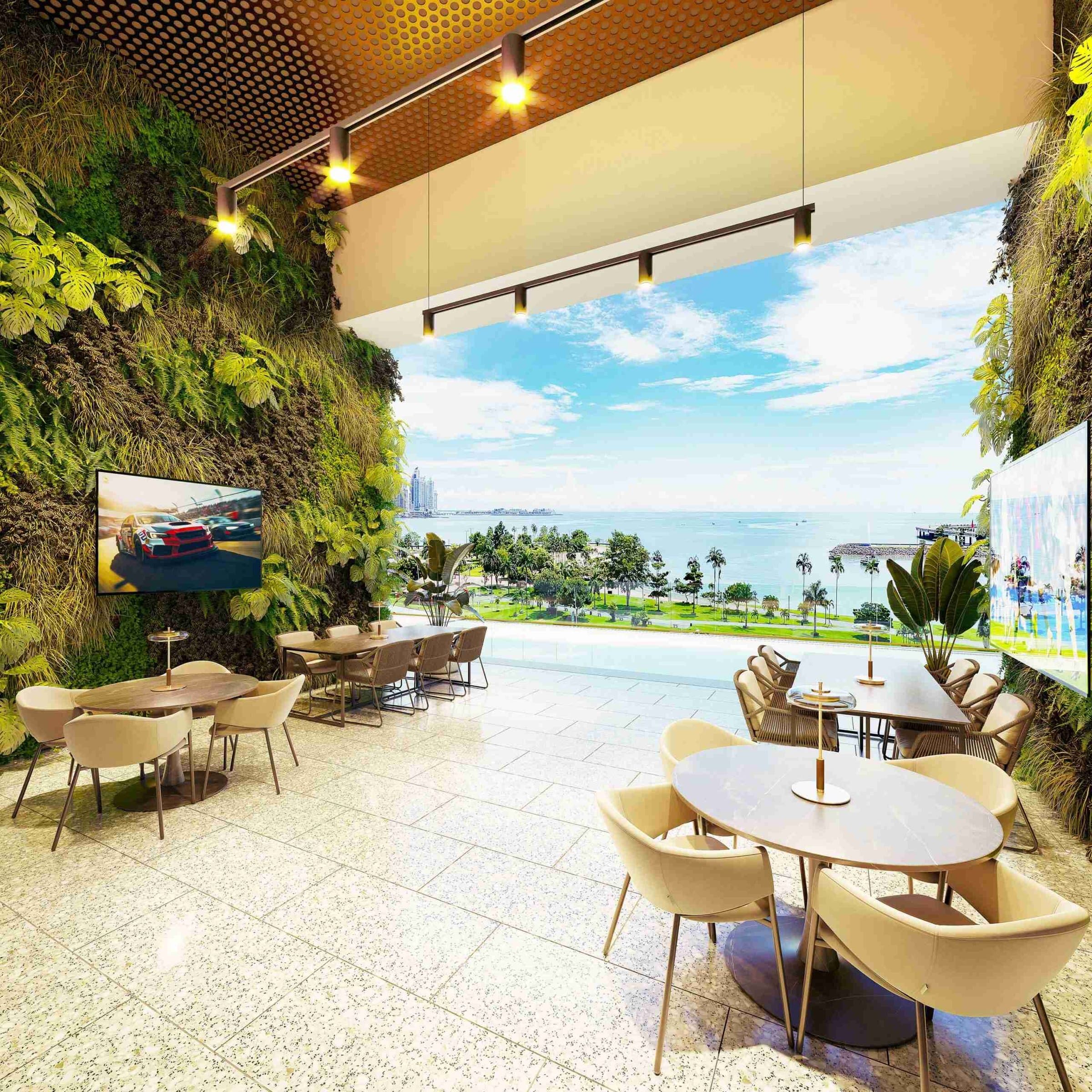 Social lobby with a green wall overlooking the ocean at The Label by Loft Art