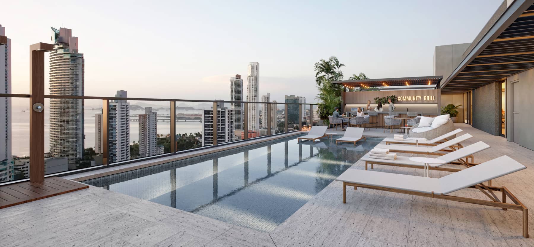 Rooftop pool with sun loungers and city view at APTTA