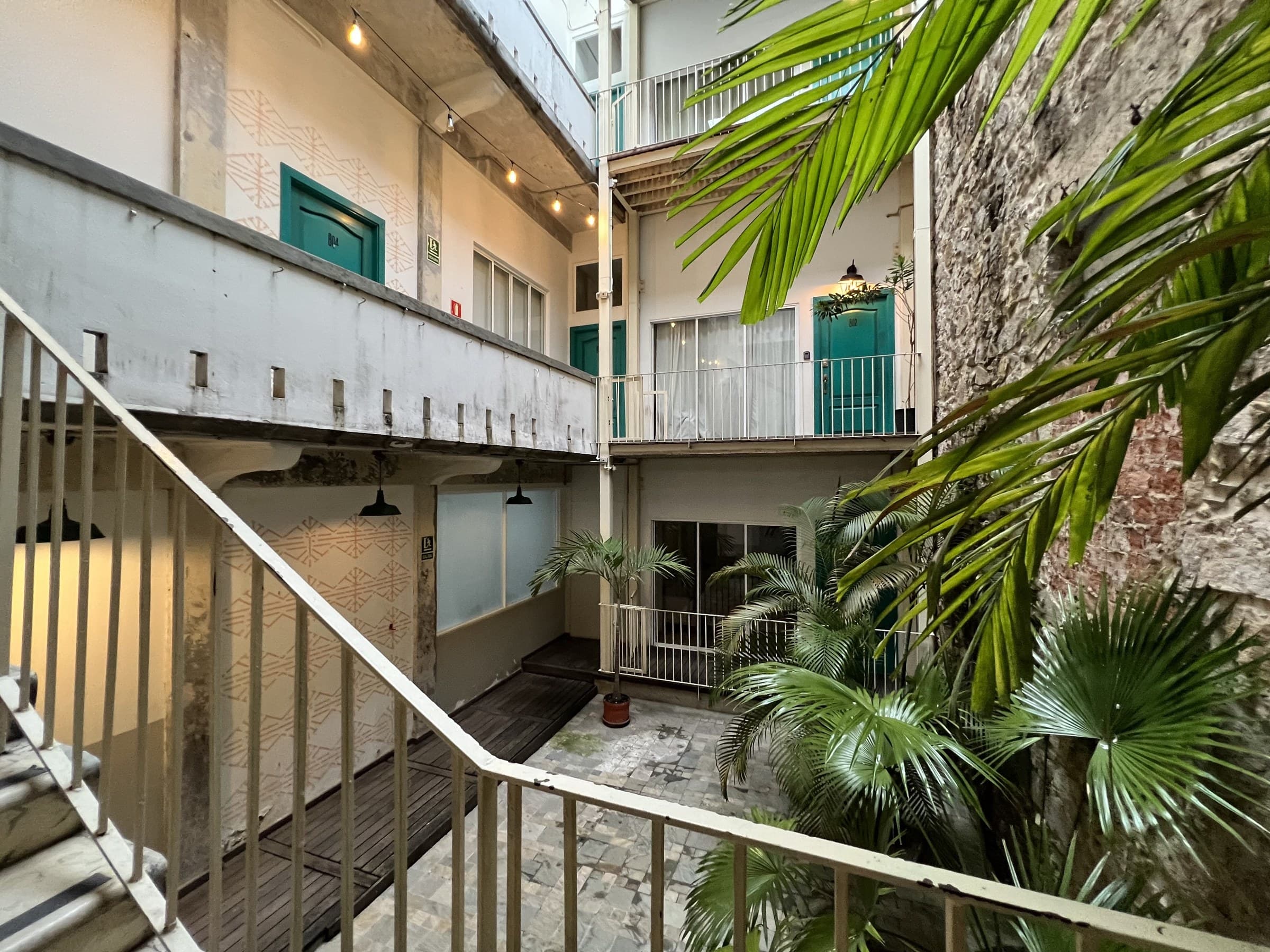 Planted internal patio and walkways of the Casa 8-23 building in Casco Antiguo
