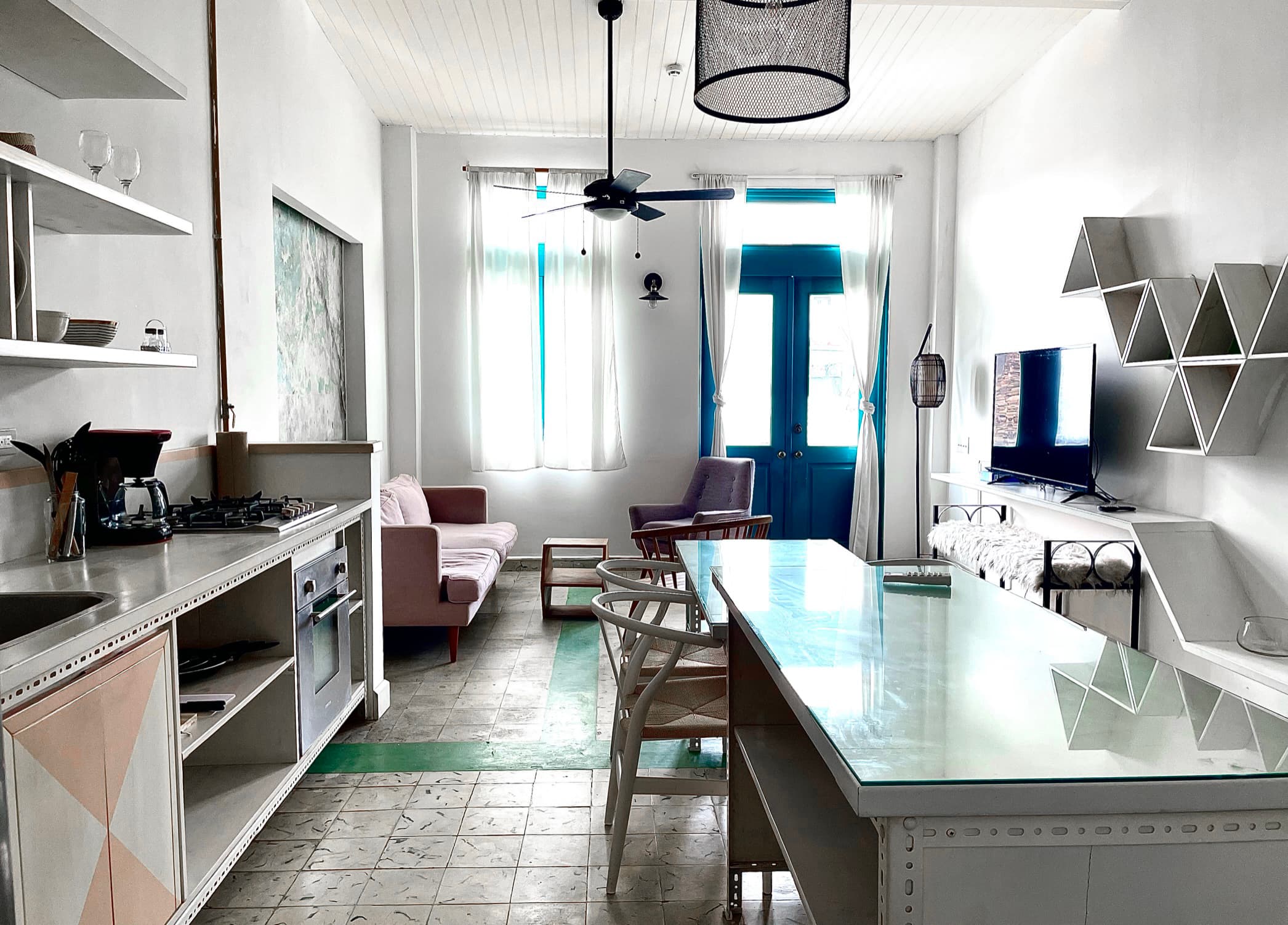 Open-plan kitchen, dining table and living room of apartment 811 at Casa 8-23