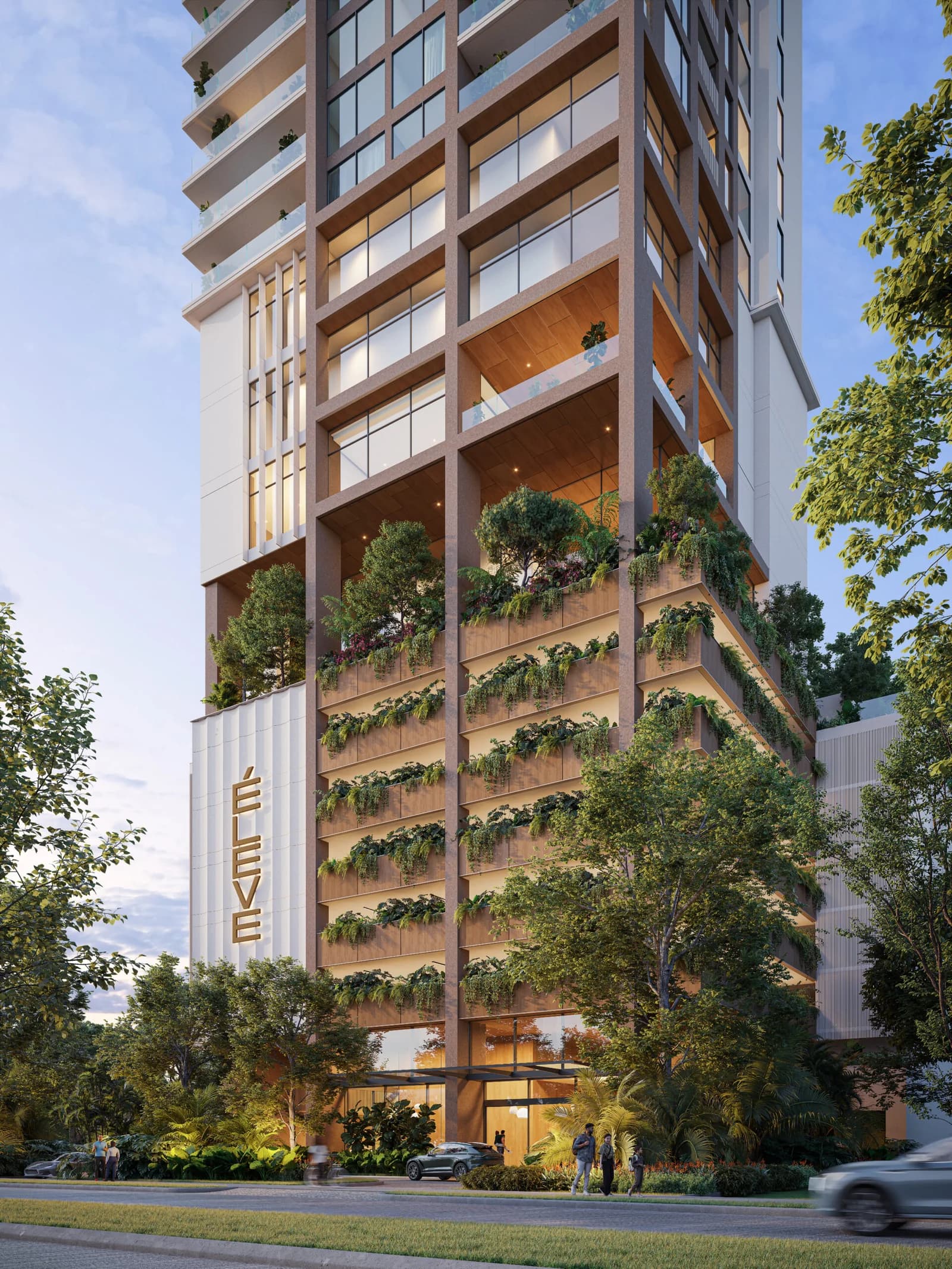 Street-level view of the Éleve tower and its planted terraces