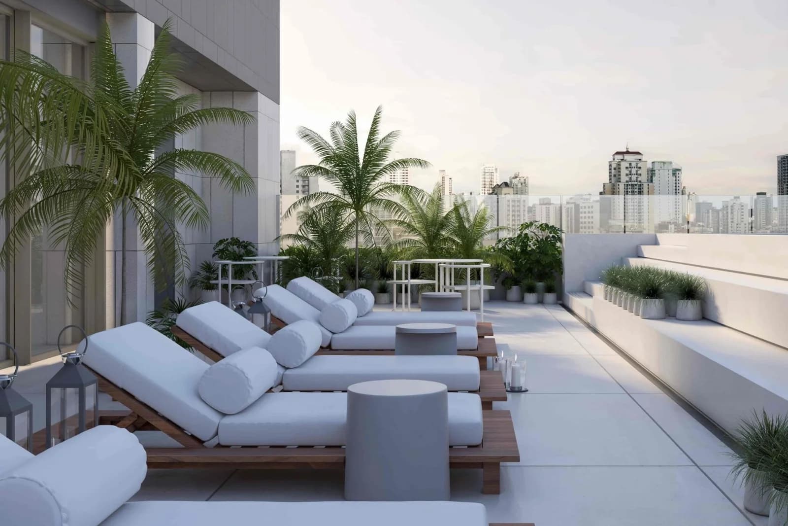 Sun loungers and palms on the rooftop of KYTE by Living