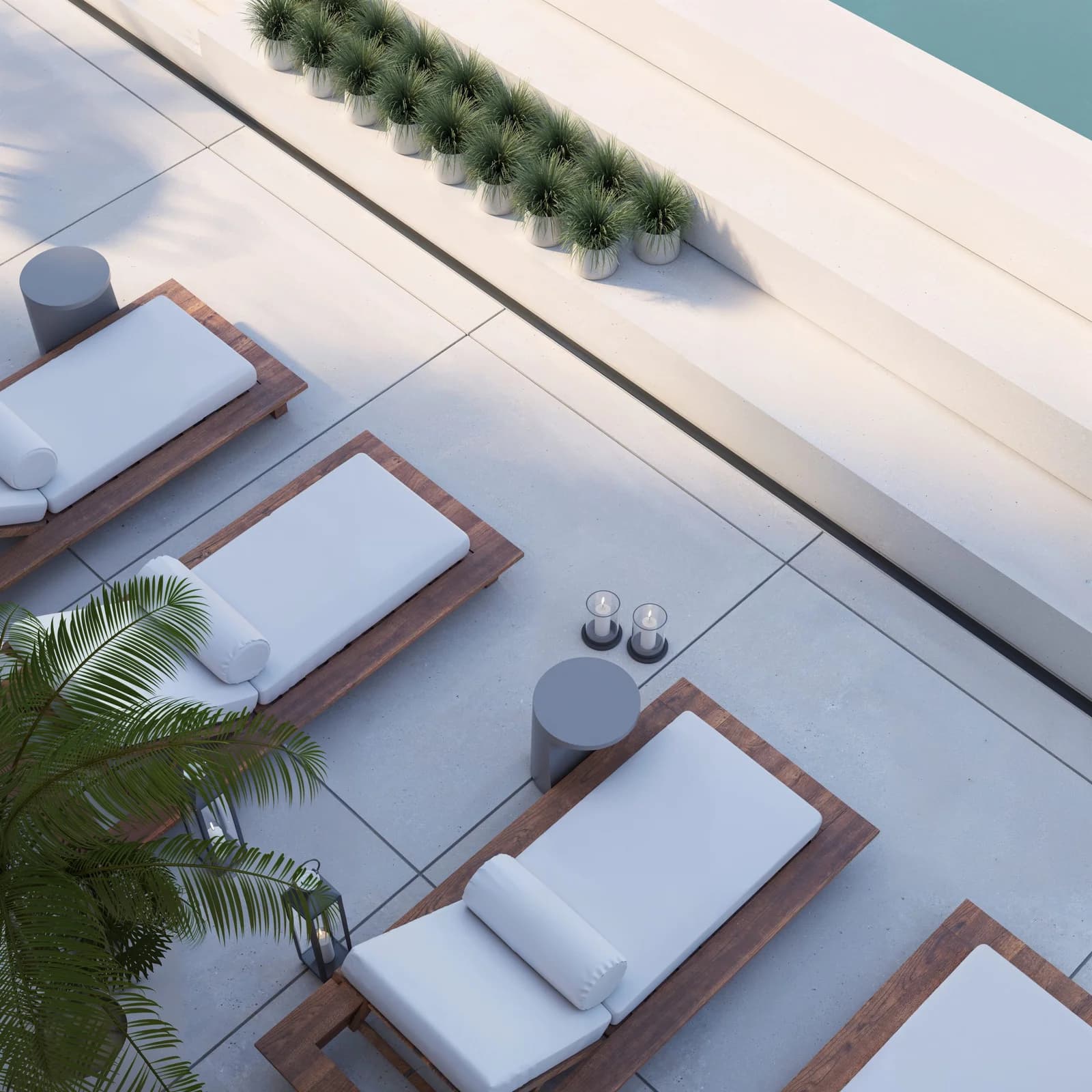 Loungers beside the salt-water pool at KYTE by Living