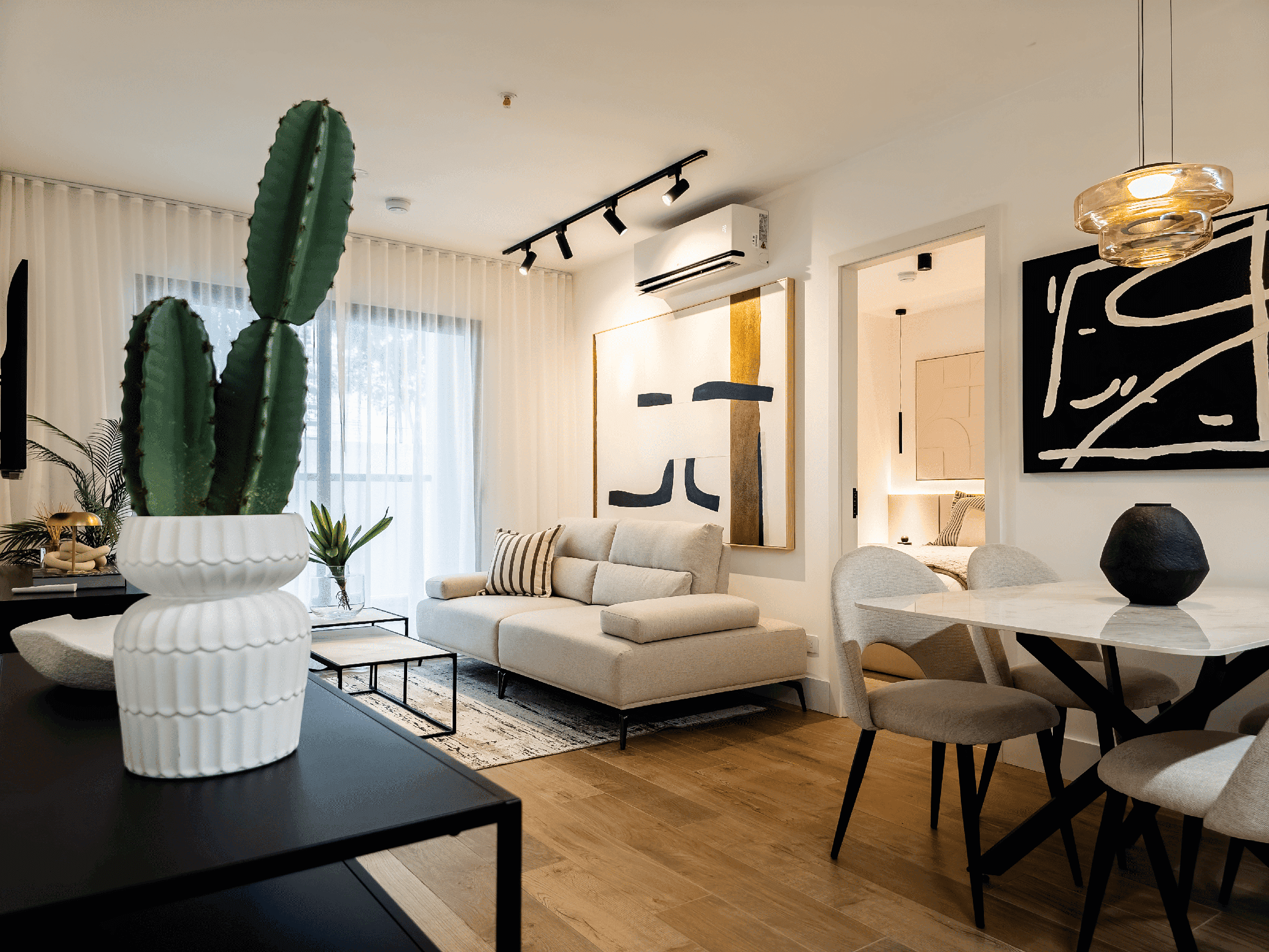 Living and dining area of the Mare Nostrum model apartment