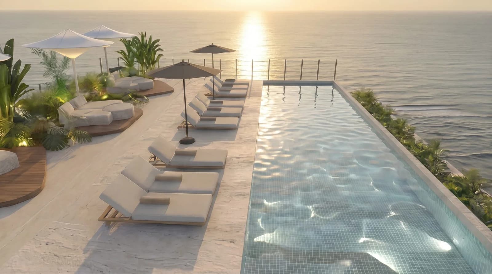 Infinity pool and sun deck facing the ocean at Selvática Residences