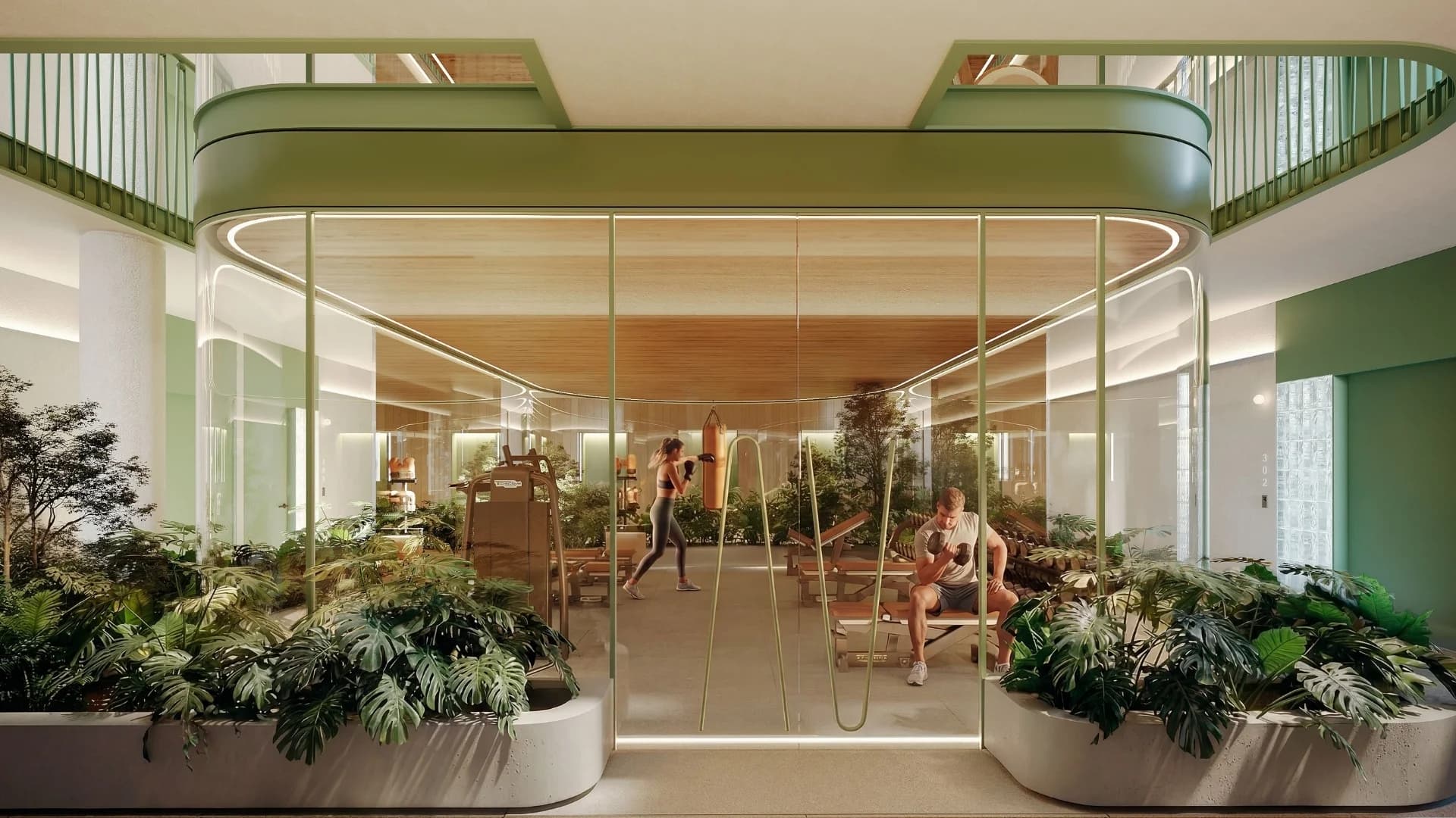 Glass-walled gym in the central atrium garden at Haven