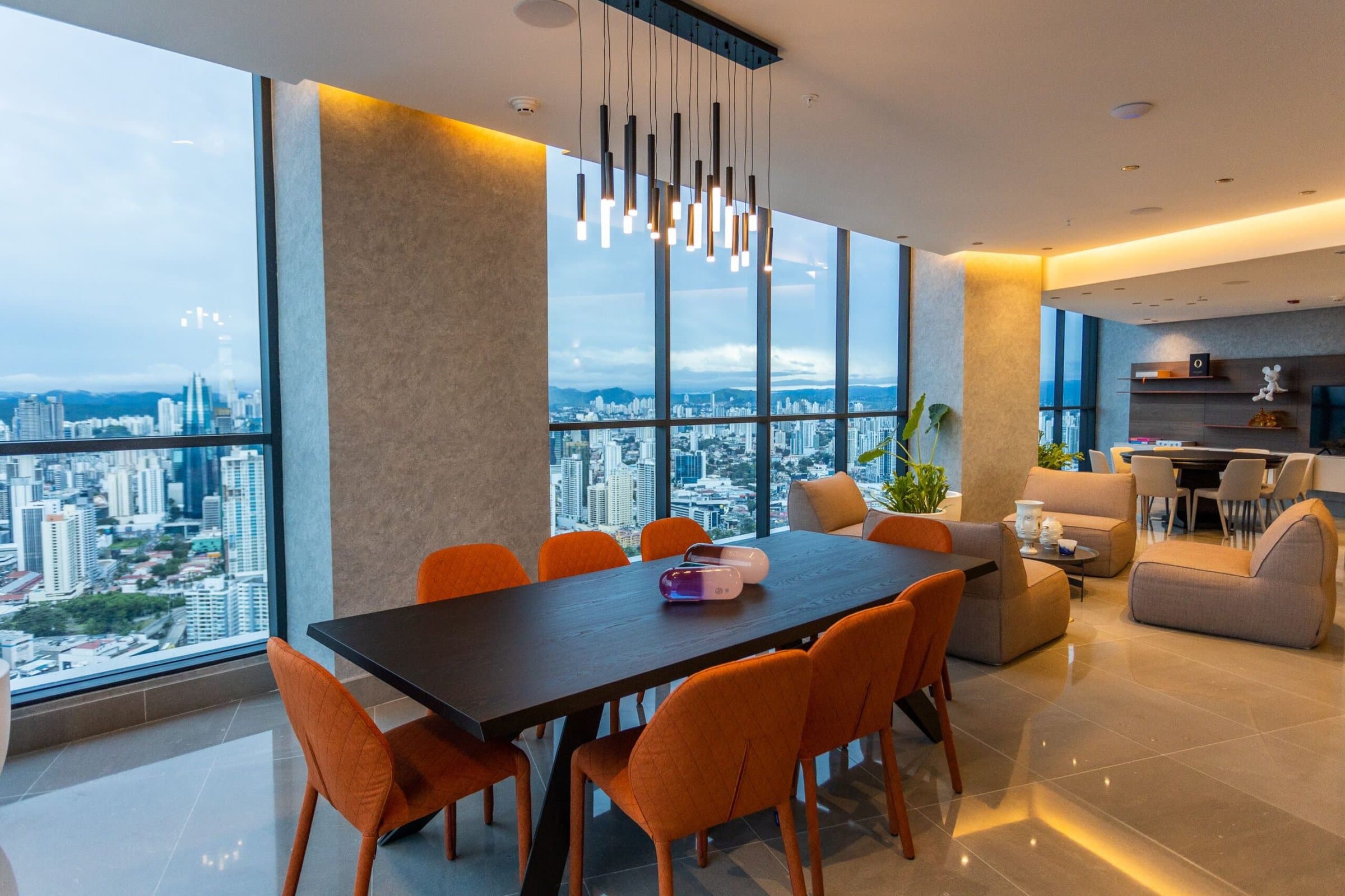 Ocean Front apartment dining room with floor-to-ceiling windows and city views