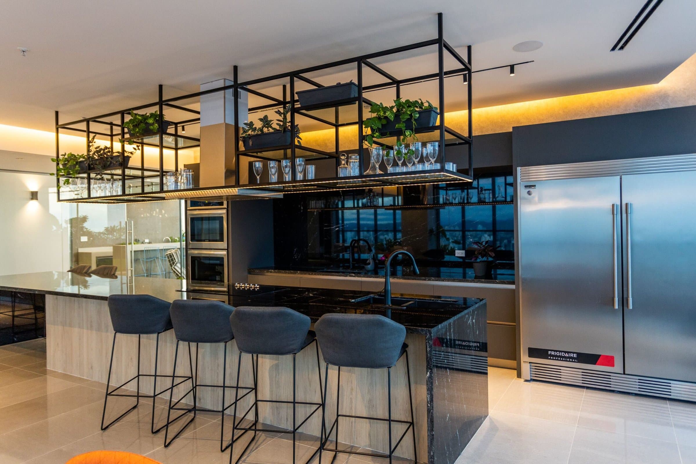 Ocean Front apartment kitchen with island, bar stools and stainless steel appliances