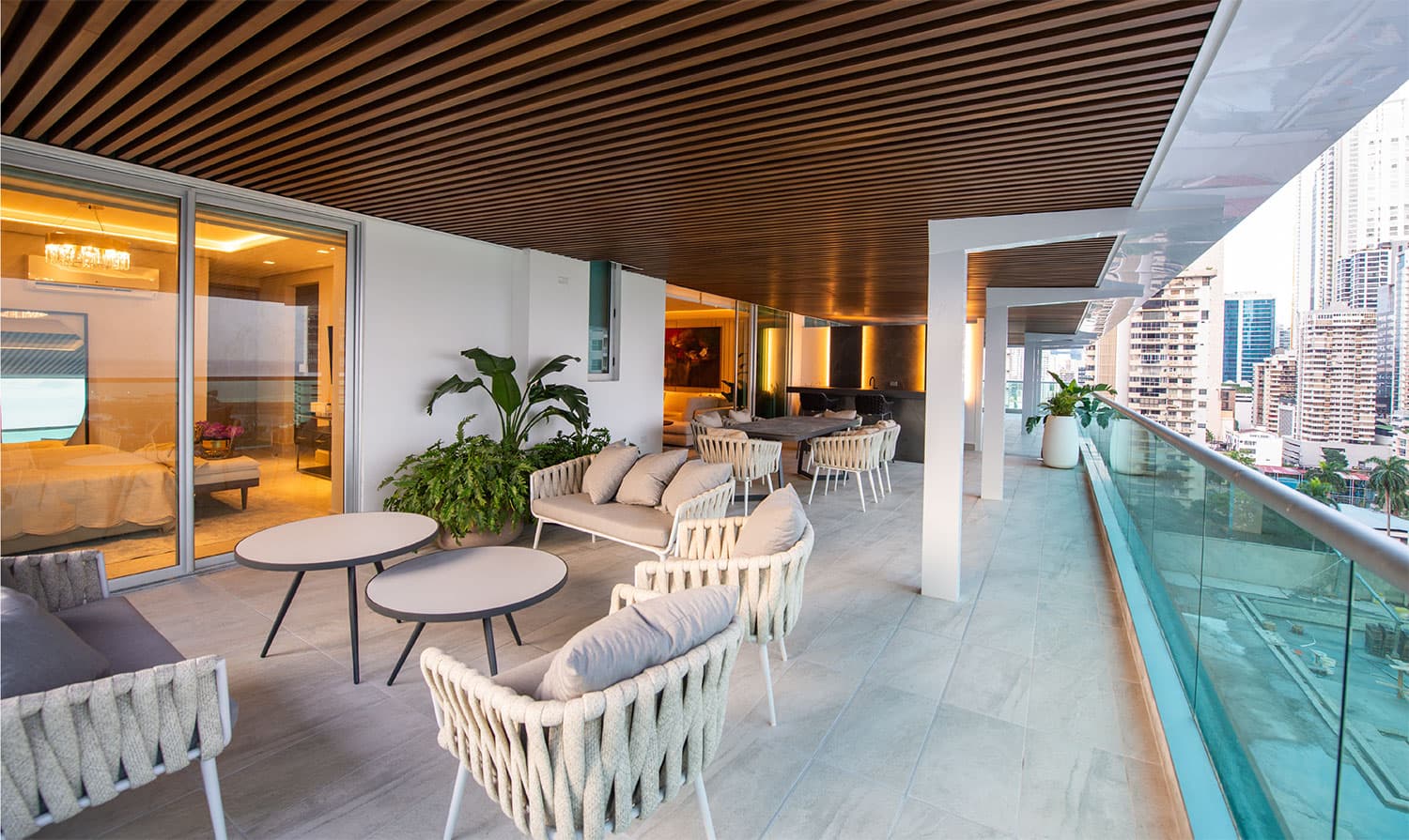 Costanera apartment terrace with lounge seating and glass railing