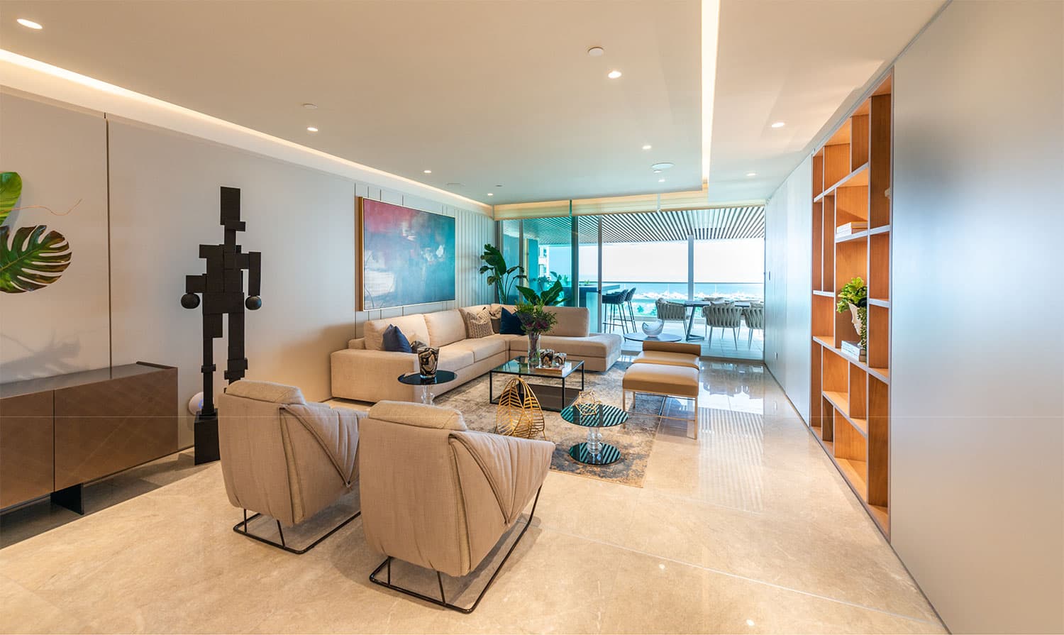 Costanera apartment living room with built-in shelving and terrace windows