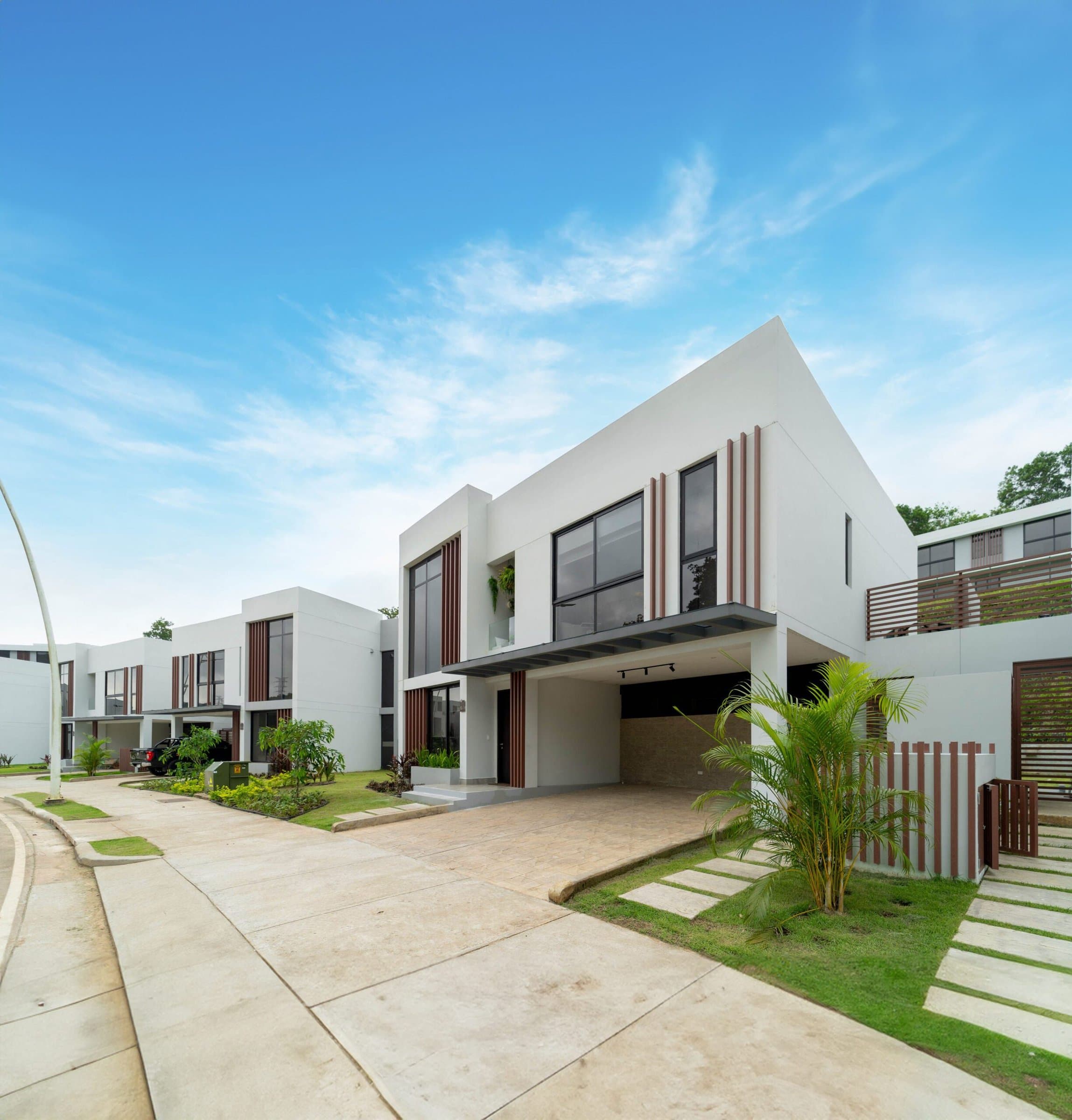 Riverwalk Villas two-story modern house on a curving street in Green City