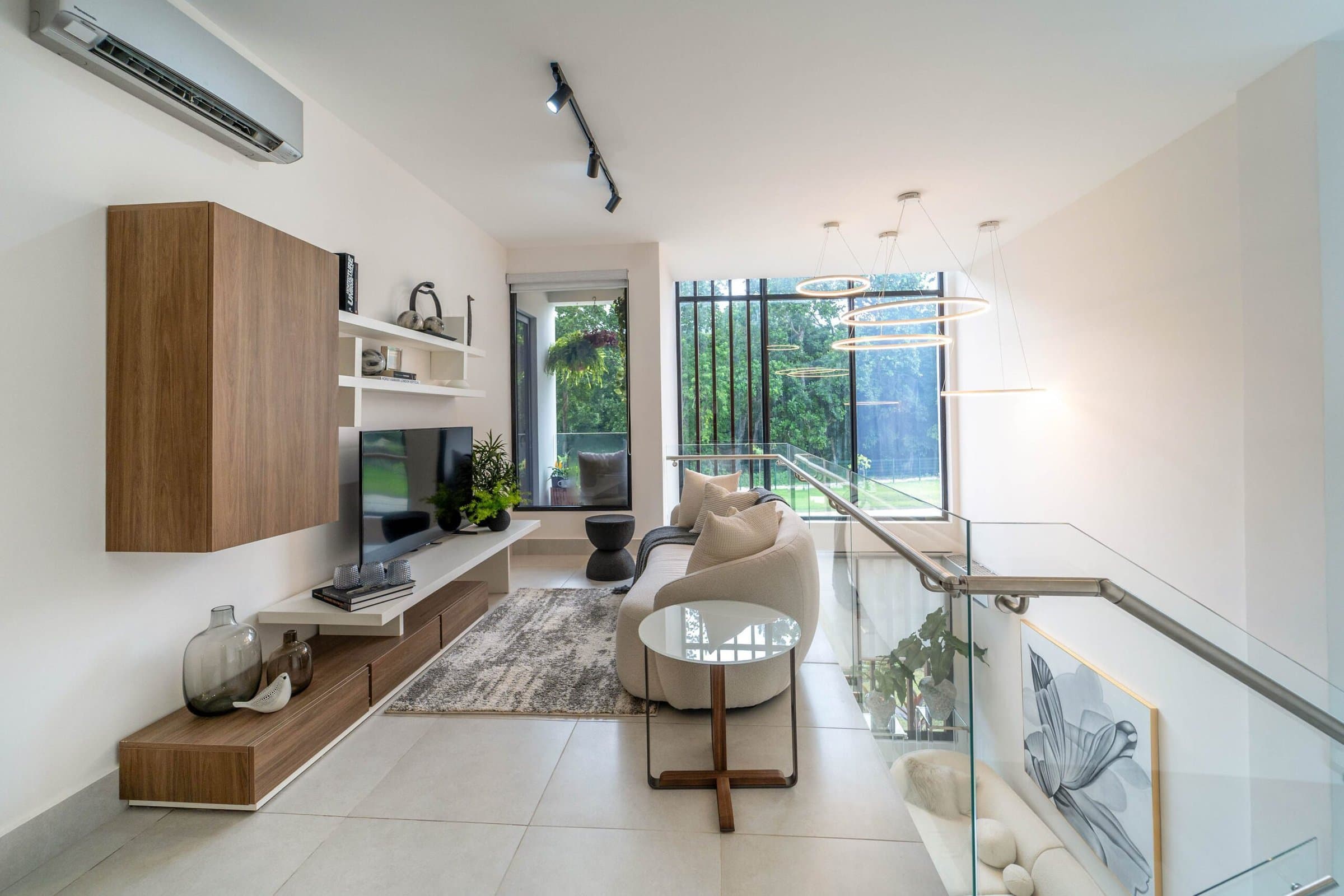 Riverwalk Villas upstairs family room with glass railing