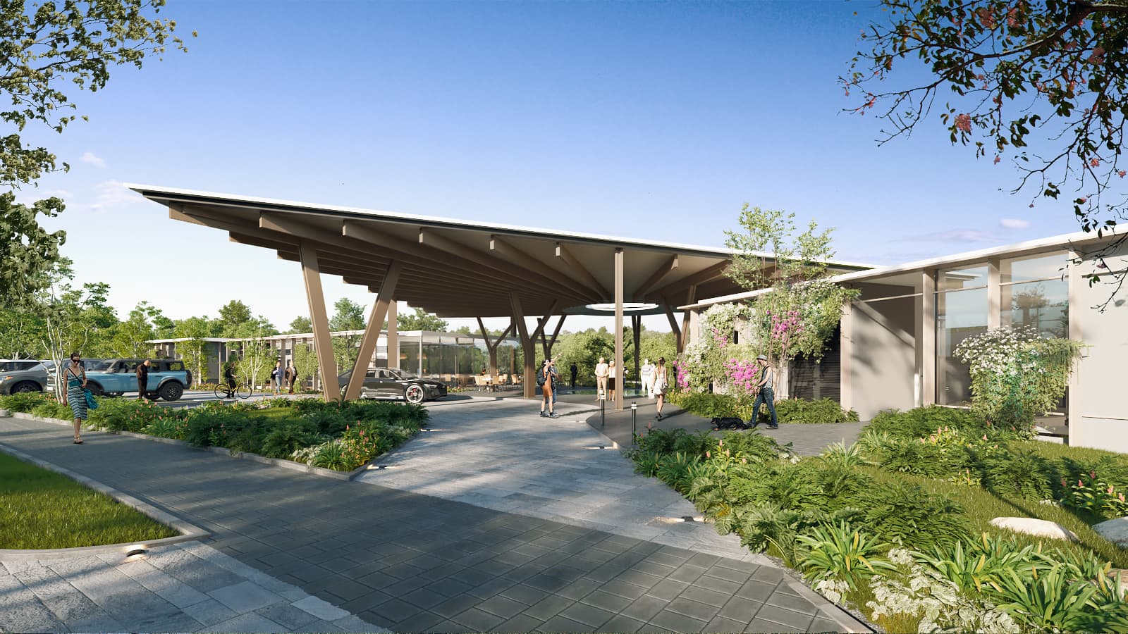 Aura community entrance with canopy and landscaped walkway