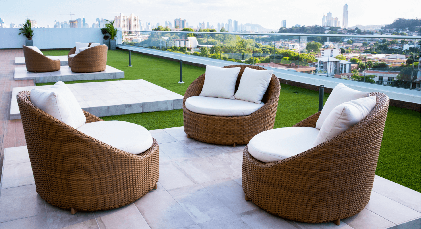 Sky Point rooftop terrace with wicker lounge chairs