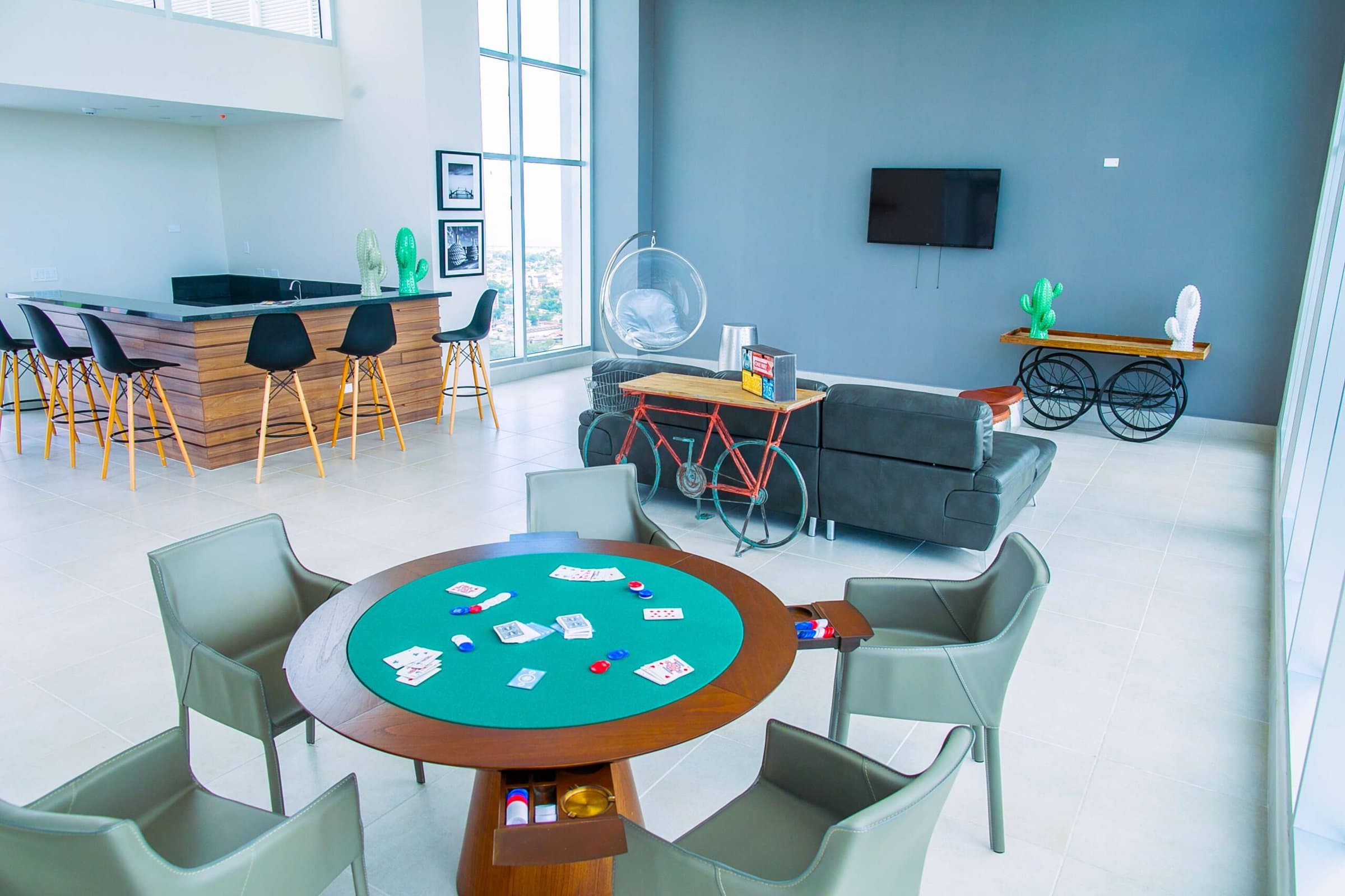 Sky Point social room with bar and card table