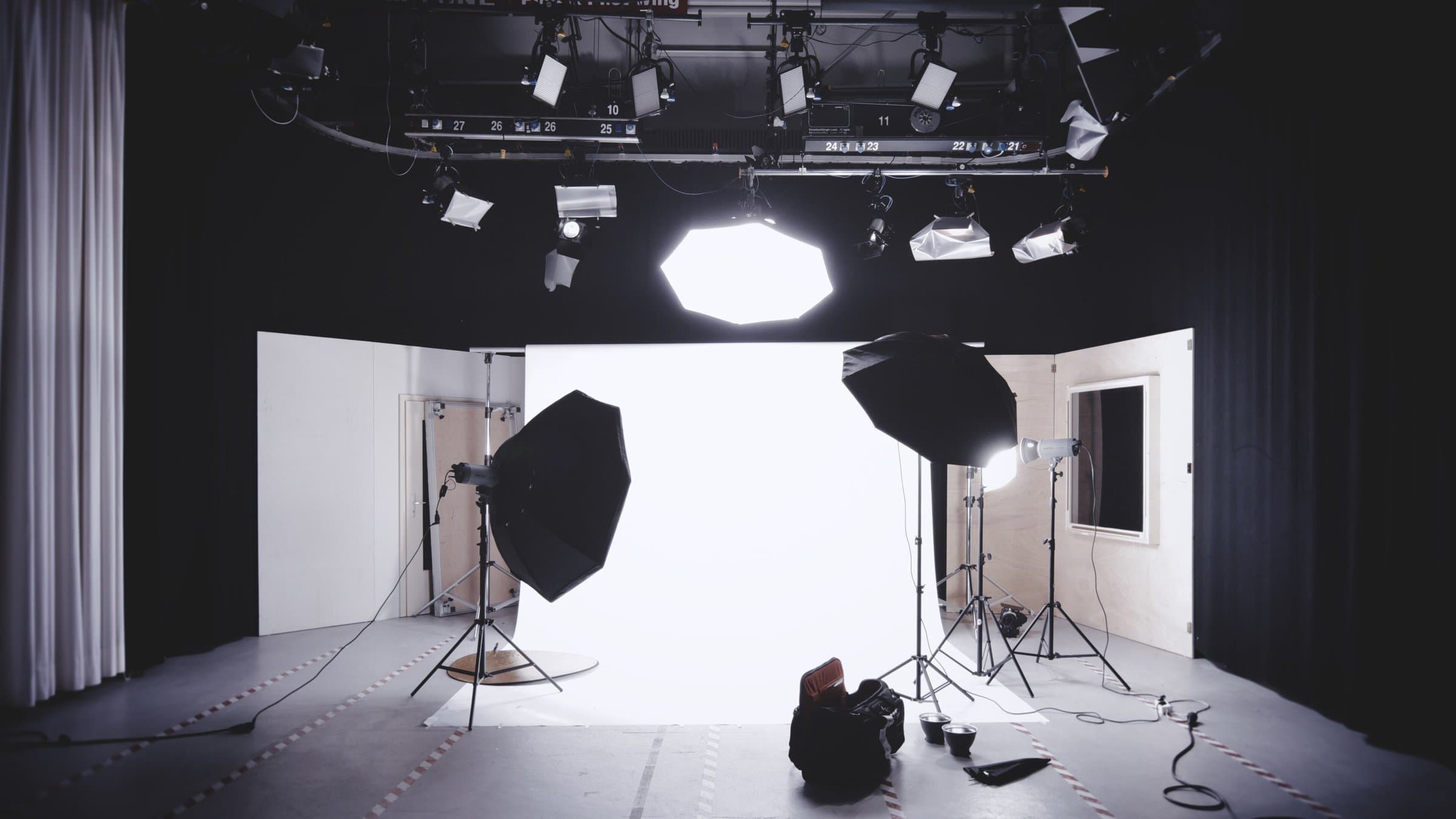 Creative studio set up for photography with softbox lights and a white backdrop