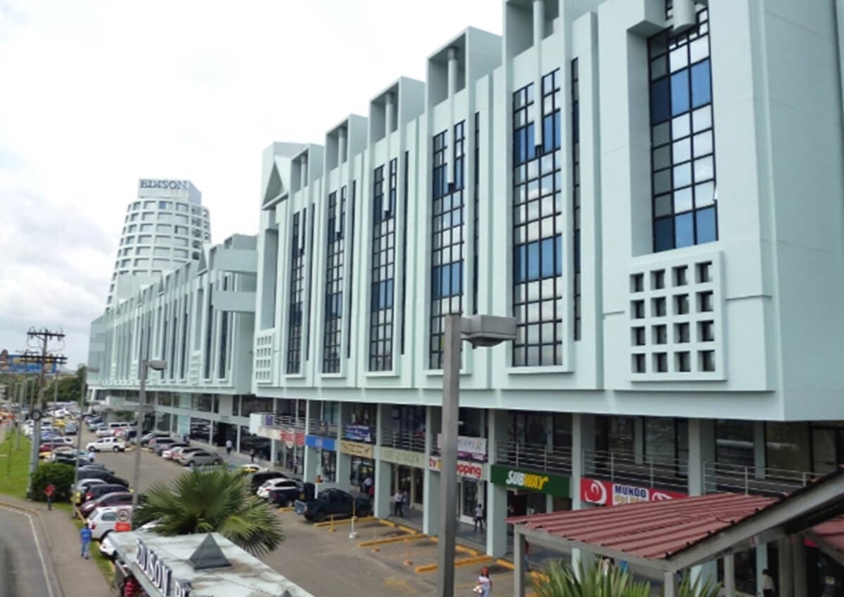 Edison Plaza commercial and office building facade with storefronts and parking