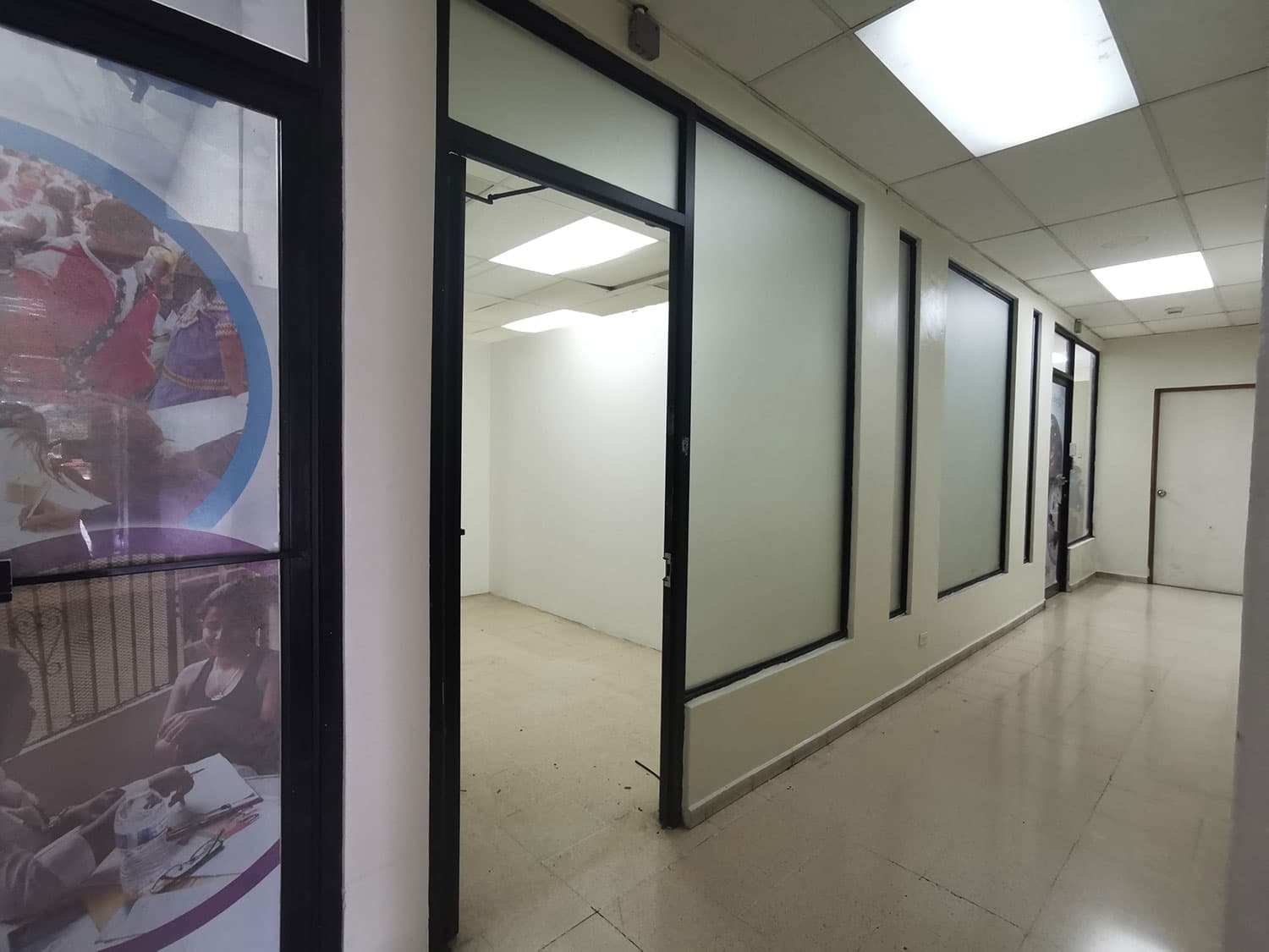 Edison Plaza office corridor with glass-partitioned units