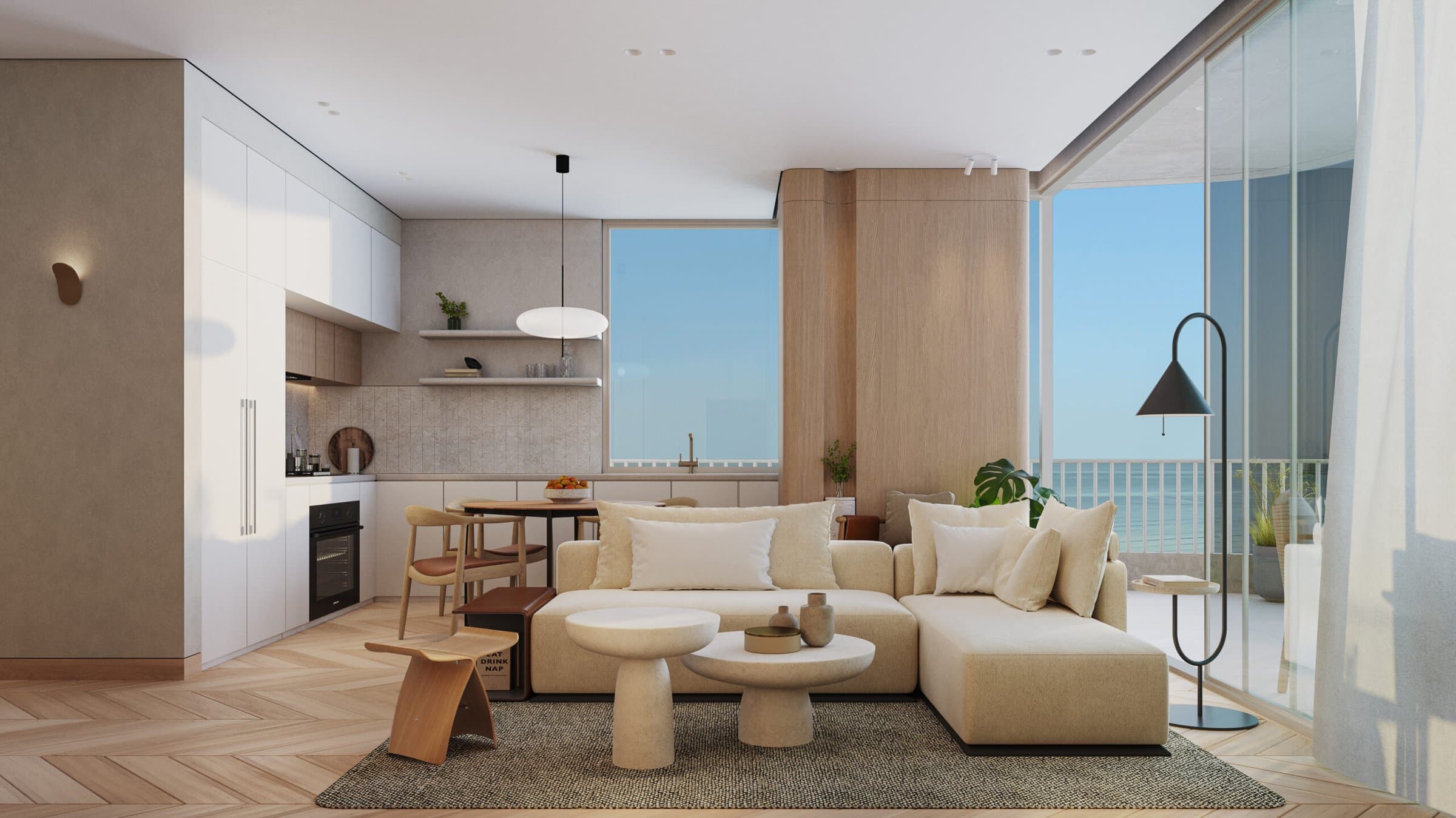 Living room and open kitchen with ocean view in an Ipanema apartment