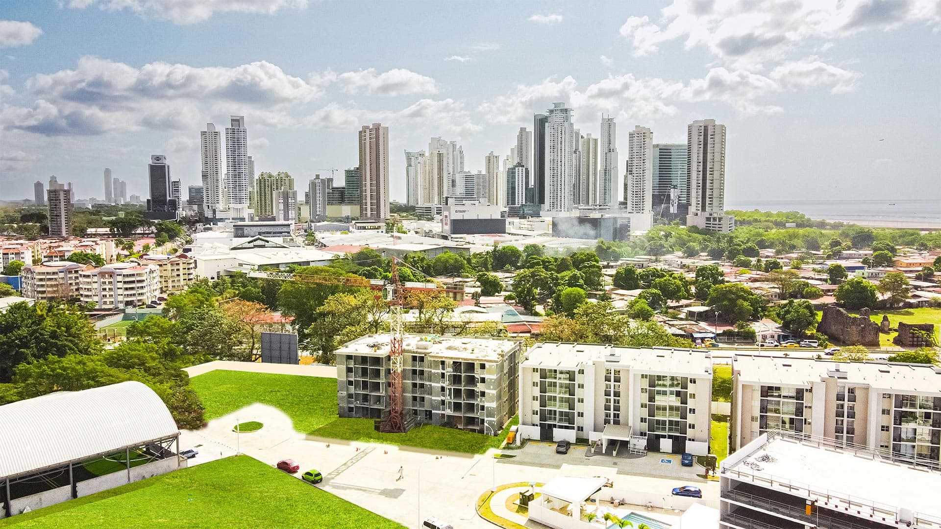 Panama Viejo Residences buildings seen from above with the city skyline and the bay