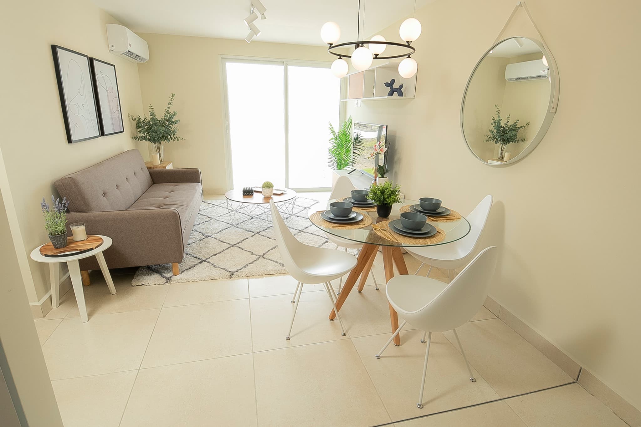 Dining area with round table in a Panama Viejo Residences apartment