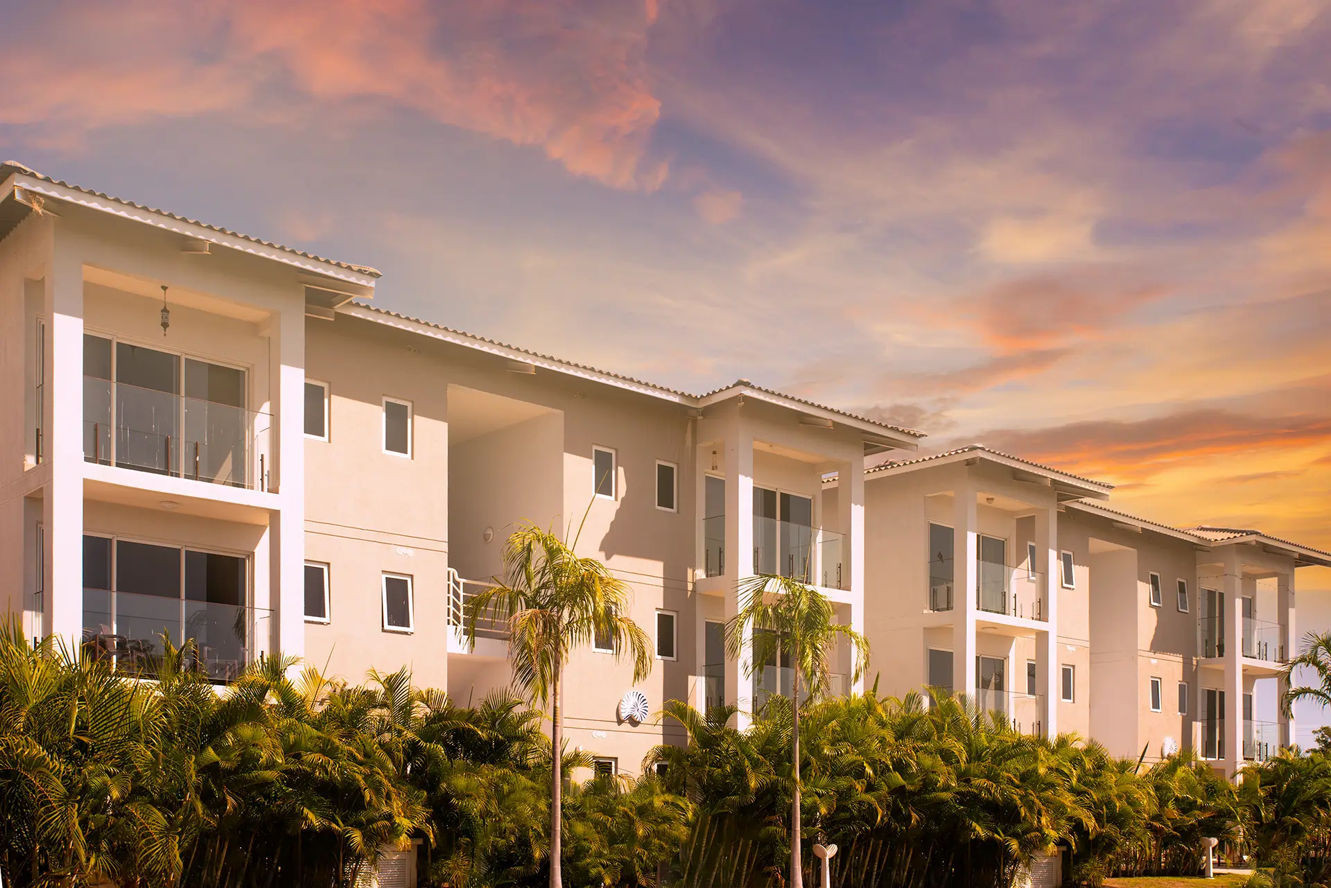 Aires del Mar garden apartment buildings at sunset in Playa Caracol