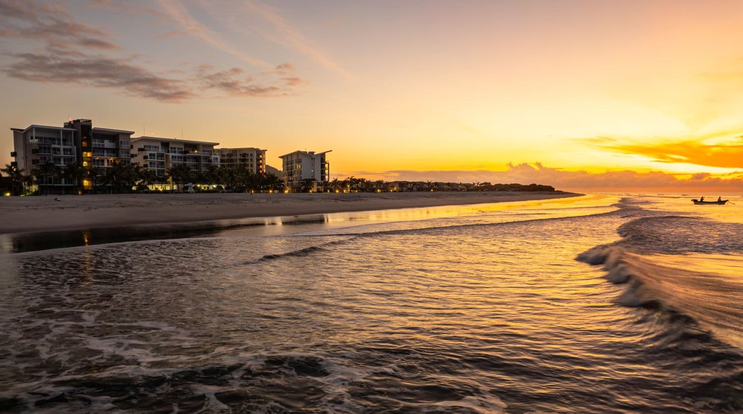 Sunset over the beach at Playa Caracol, the beach community of Aires del Mar