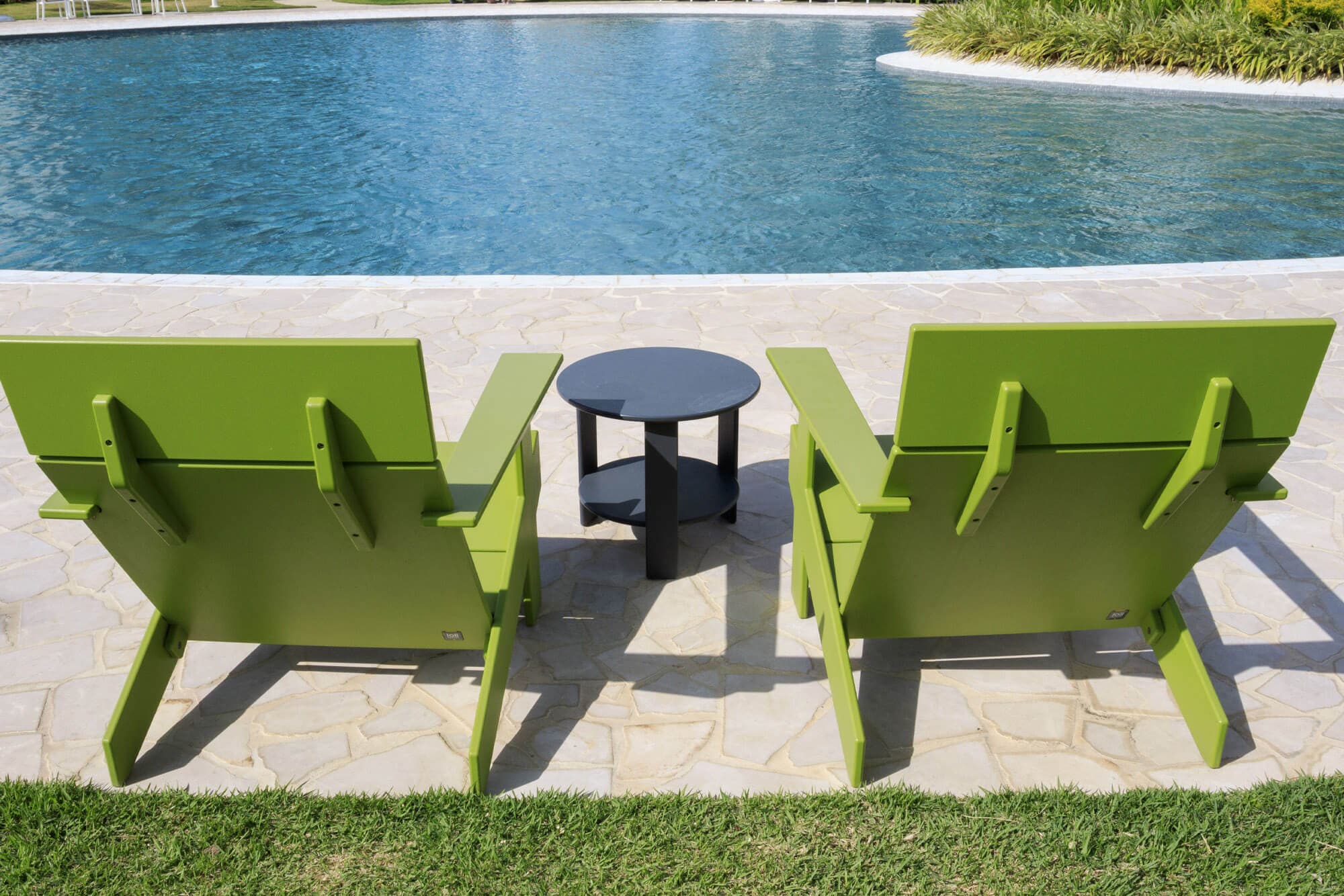 Lounge chairs beside the pool at Olas del Mar, Playa Caracol