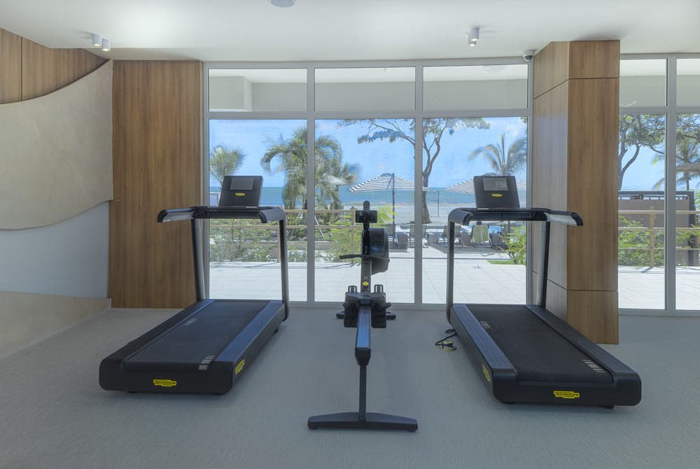 Surfside gym with ocean-facing windows