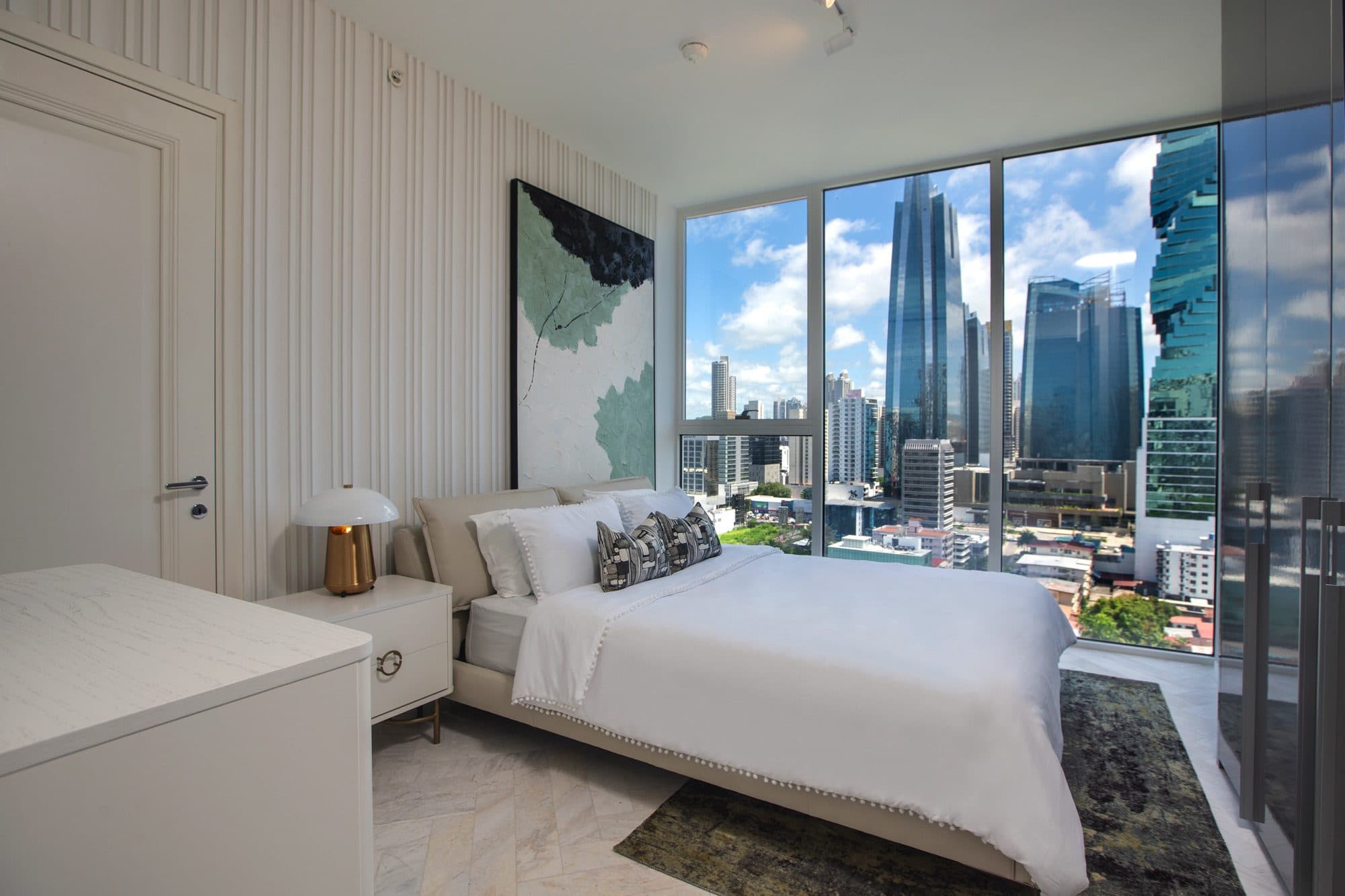 Wanders & Yoo bedroom with floor-to-ceiling windows and city views