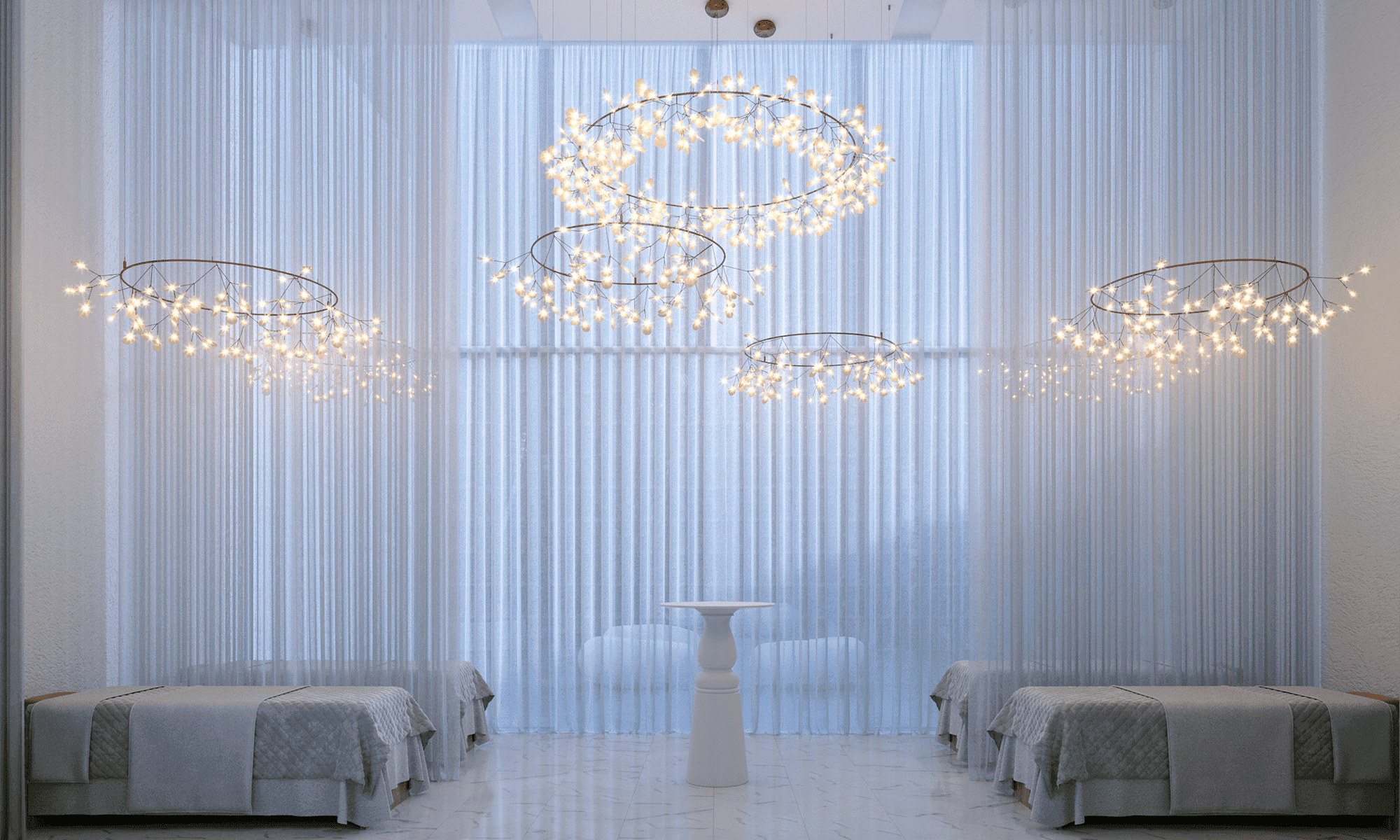 Wanders & Yoo spa treatment room with sheer curtains and chandeliers