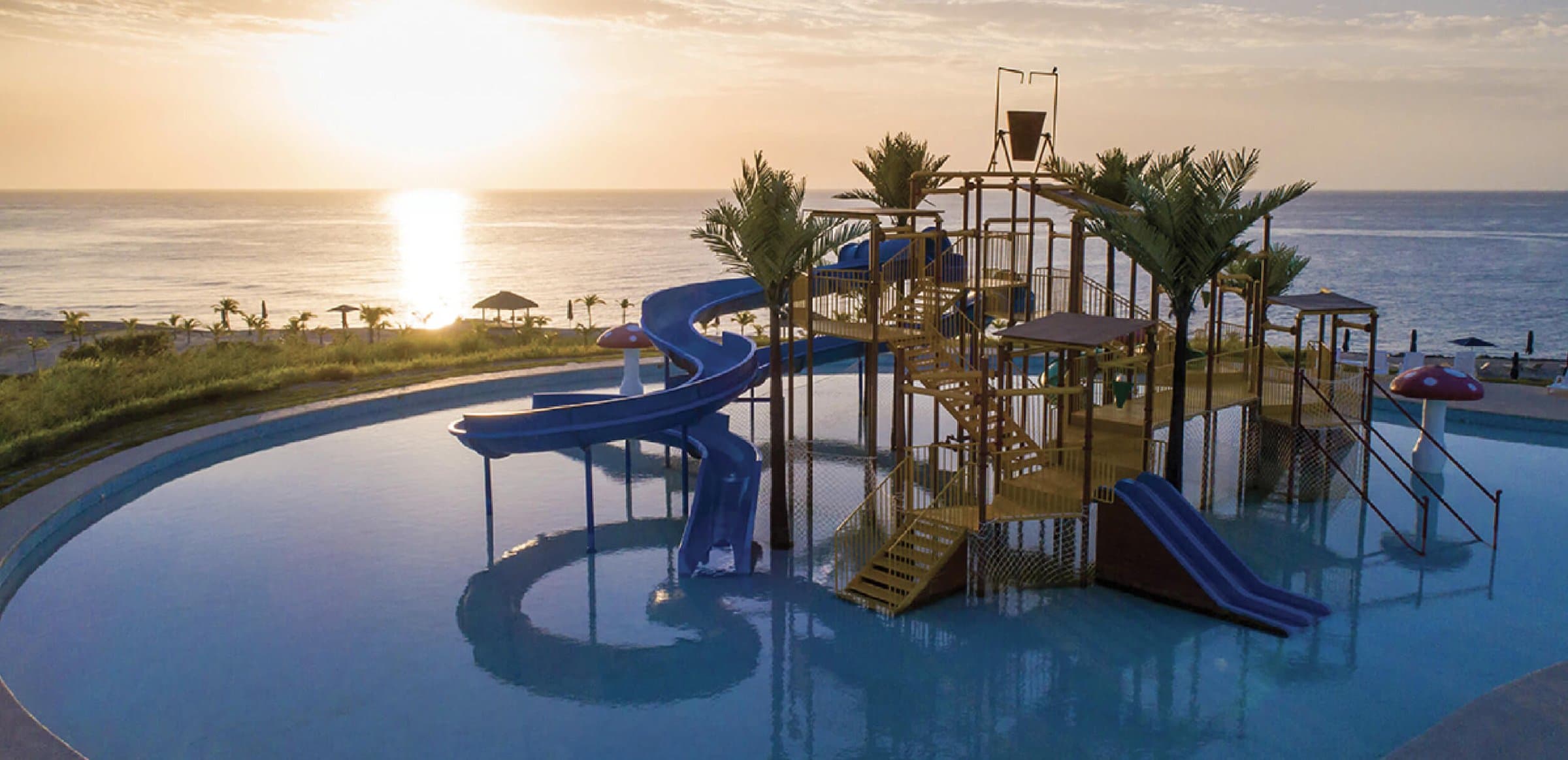 Water park with slides at Casamar at sunset