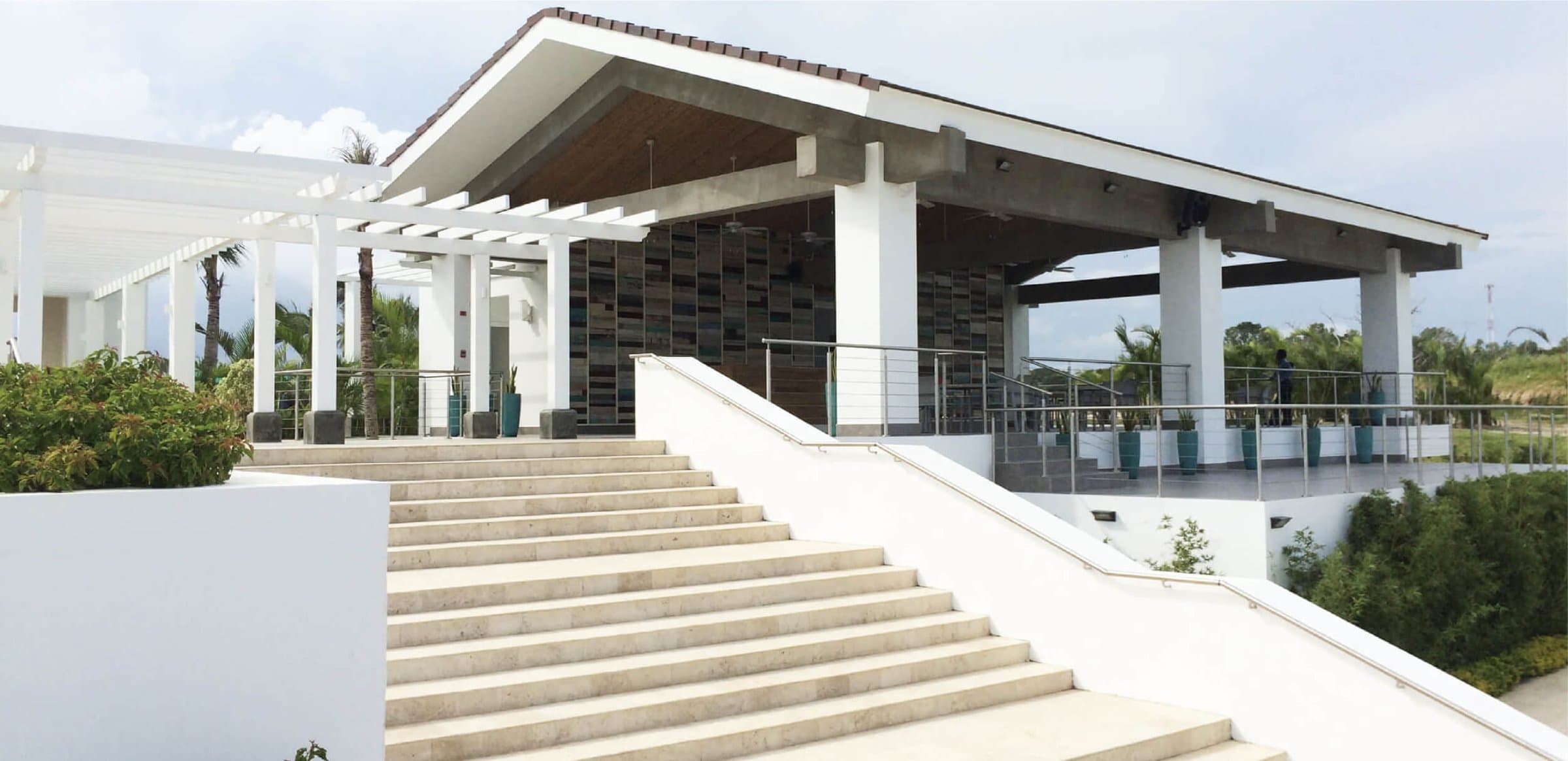 Casamar clubhouse entrance with stairway and pergola
