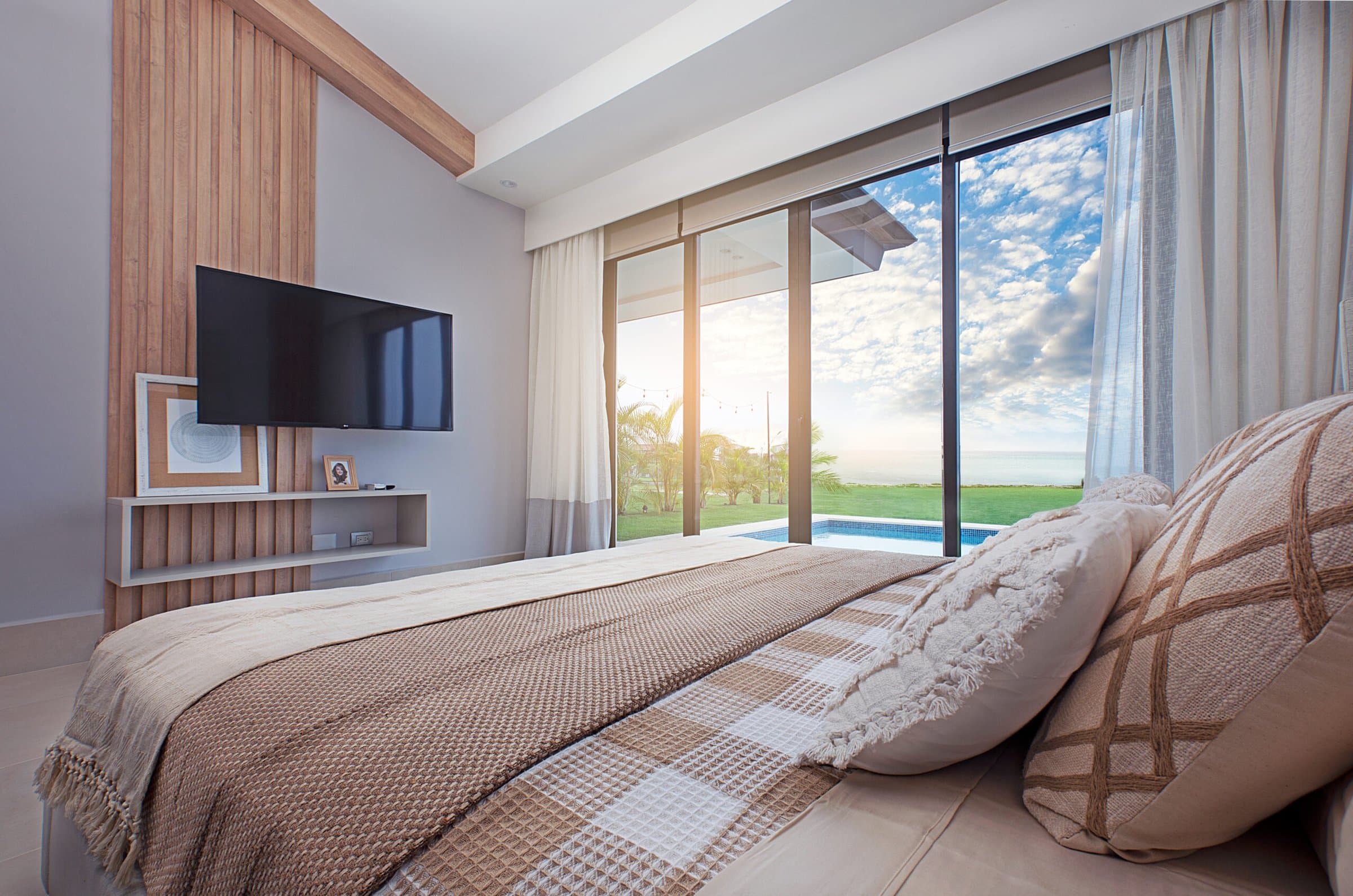 Master bedroom at Ocean Villas with sliding doors to the garden