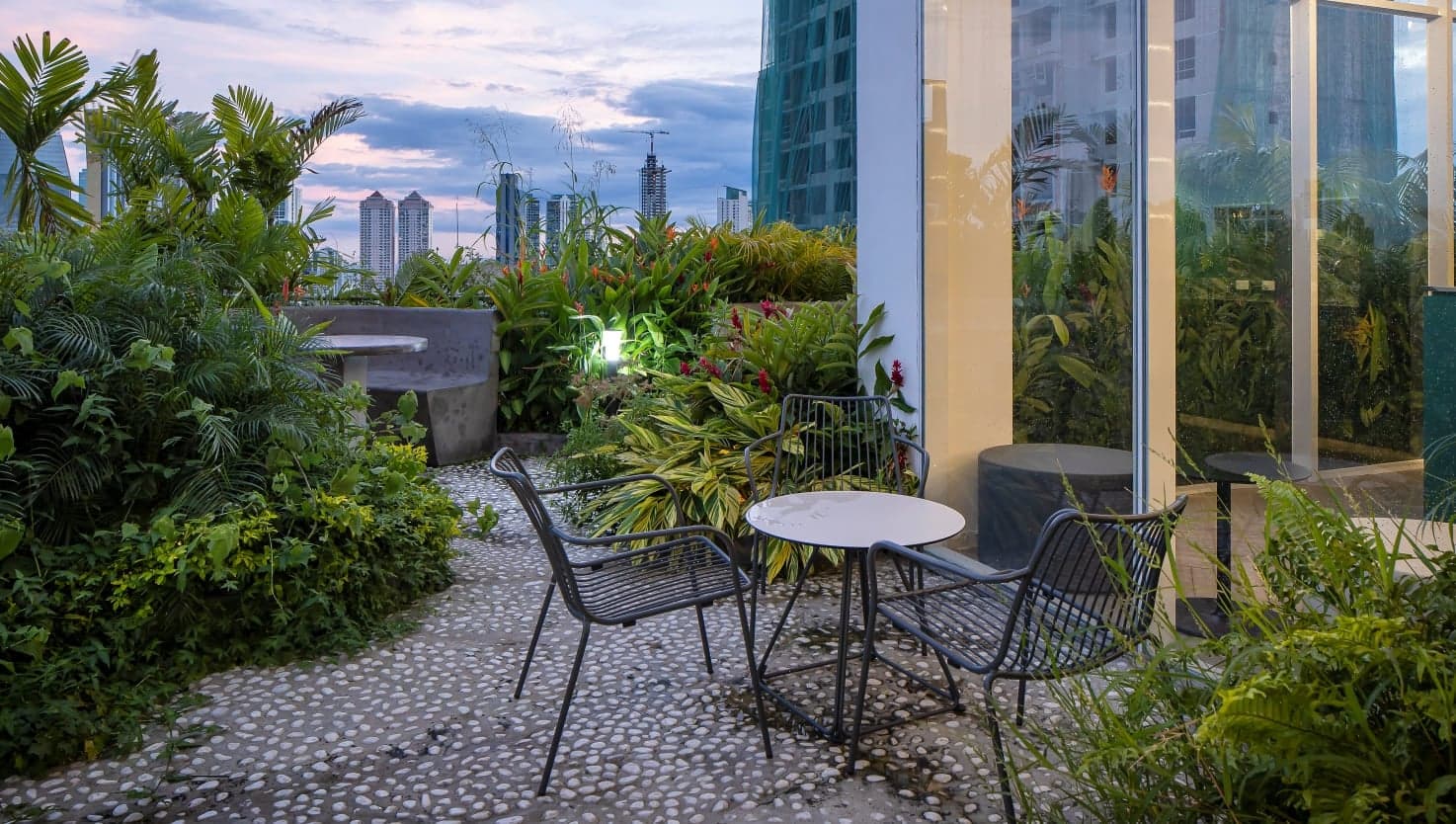 Garden seating on the Velure rooftop terrace with city views