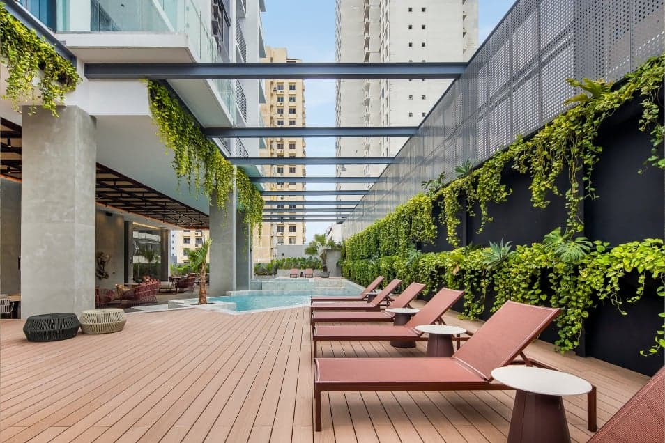 Sun deck with loungers along the Velure pool