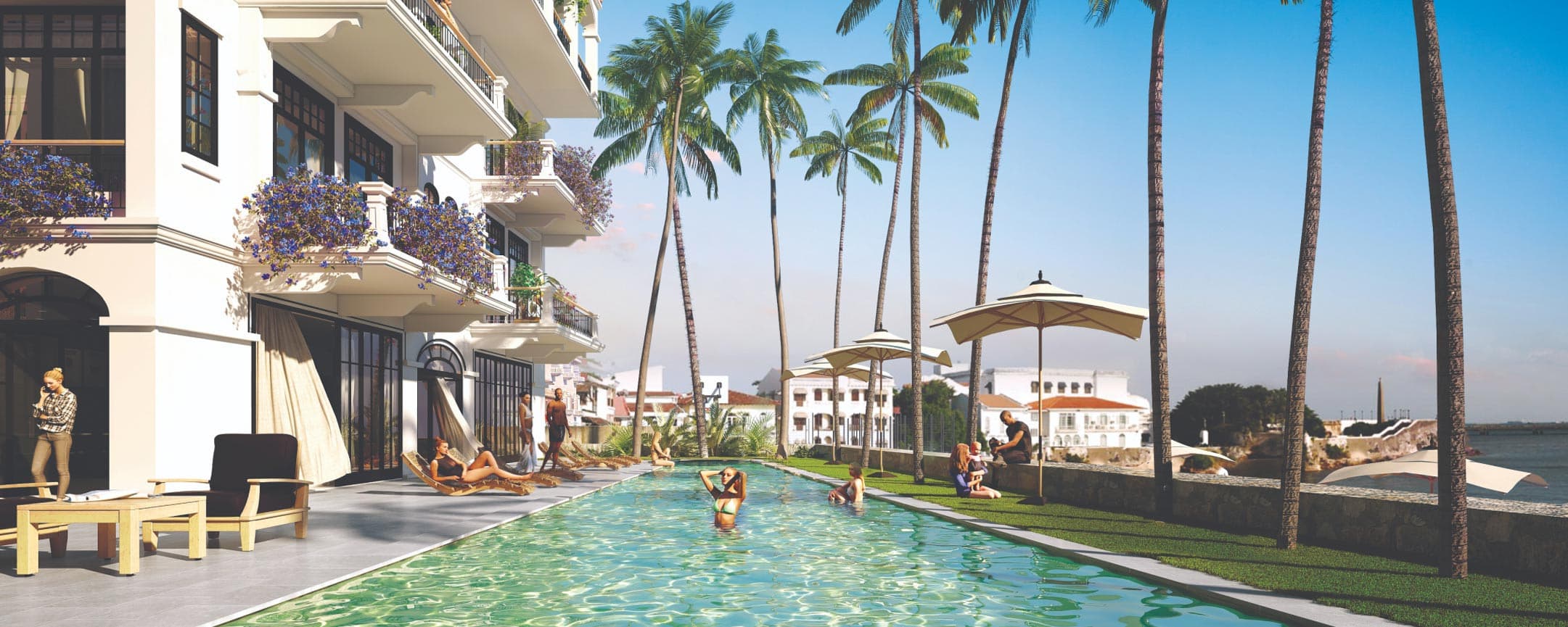 Oceanfront swimming pool and palm garden at Santa Familia in Casco Viejo