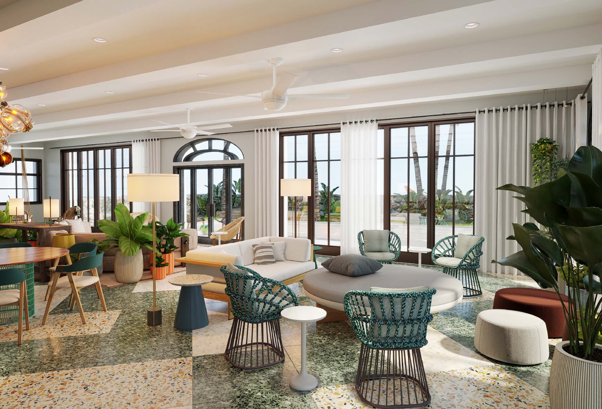 Open-plan living room with tropical furniture and tall arched windows at Santa Familia